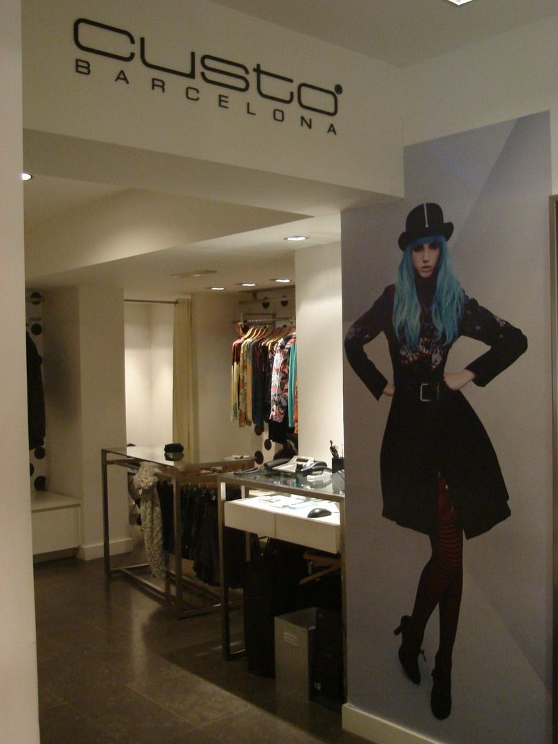 Interior area of Custo Barcelona with campaign graphics and retail furniture