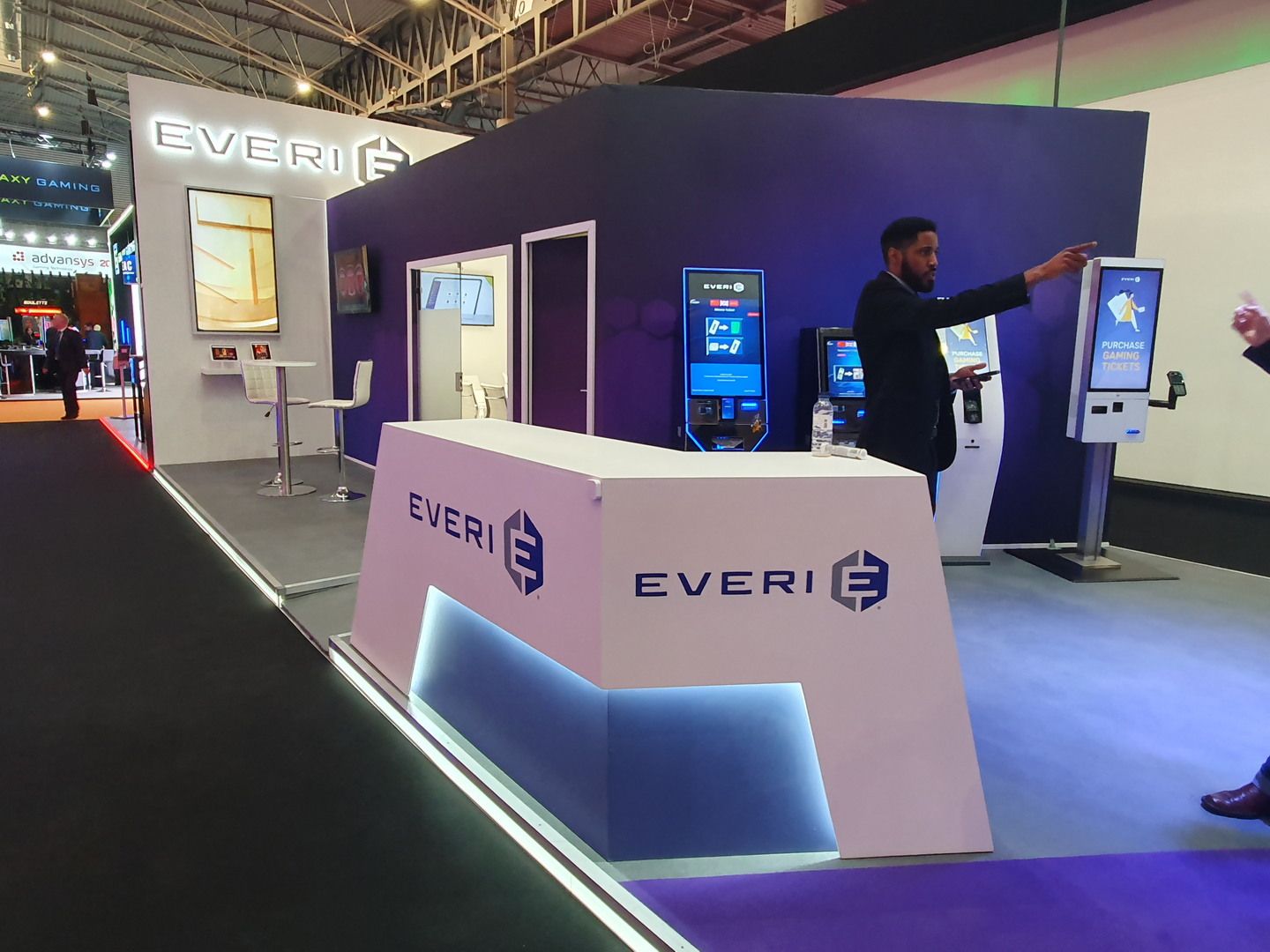Everi reception counter with integrated lighting and terminals behind