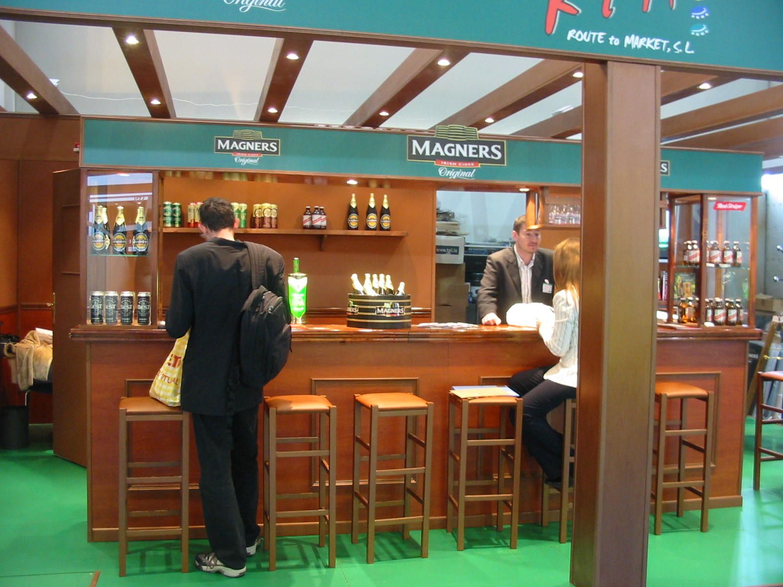 High tables in front of the cider bar — Magners · Alimentaria