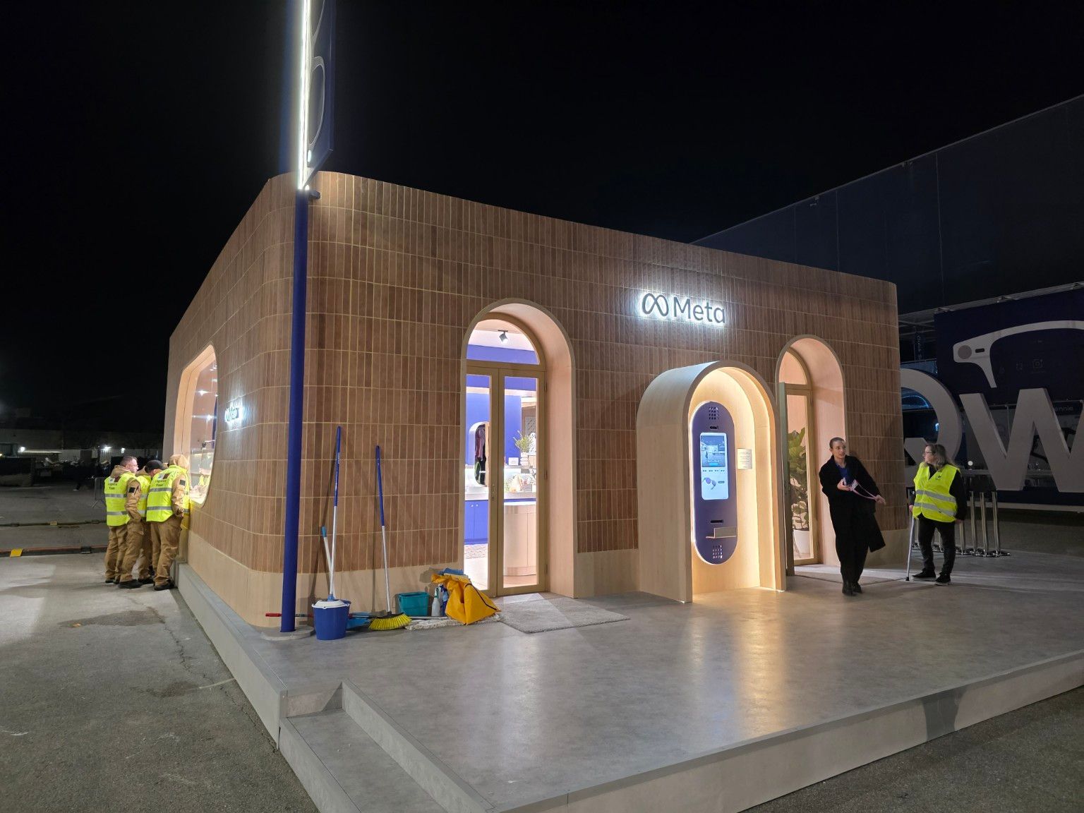 Arched entrances and illuminated demonstration terminal outside the Meta pavilion