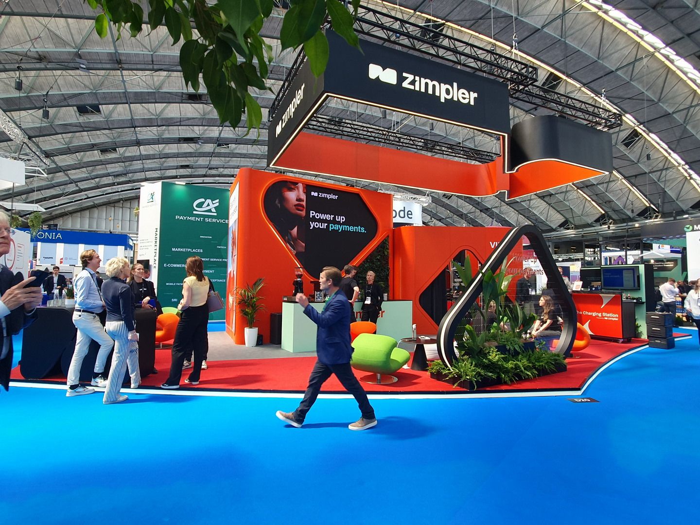 Perspective of the Zimpler stand in Amsterdam with open architecture, planting and networking space