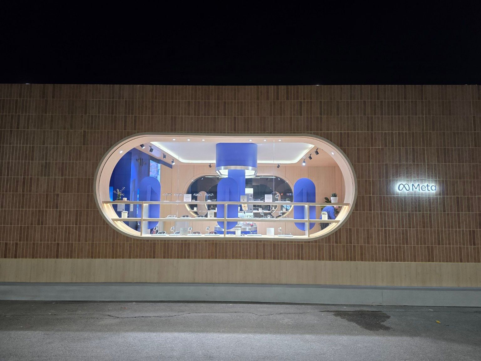 Illuminated oval display window of Meta’s outdoor pavilion at MWC Barcelona 2026