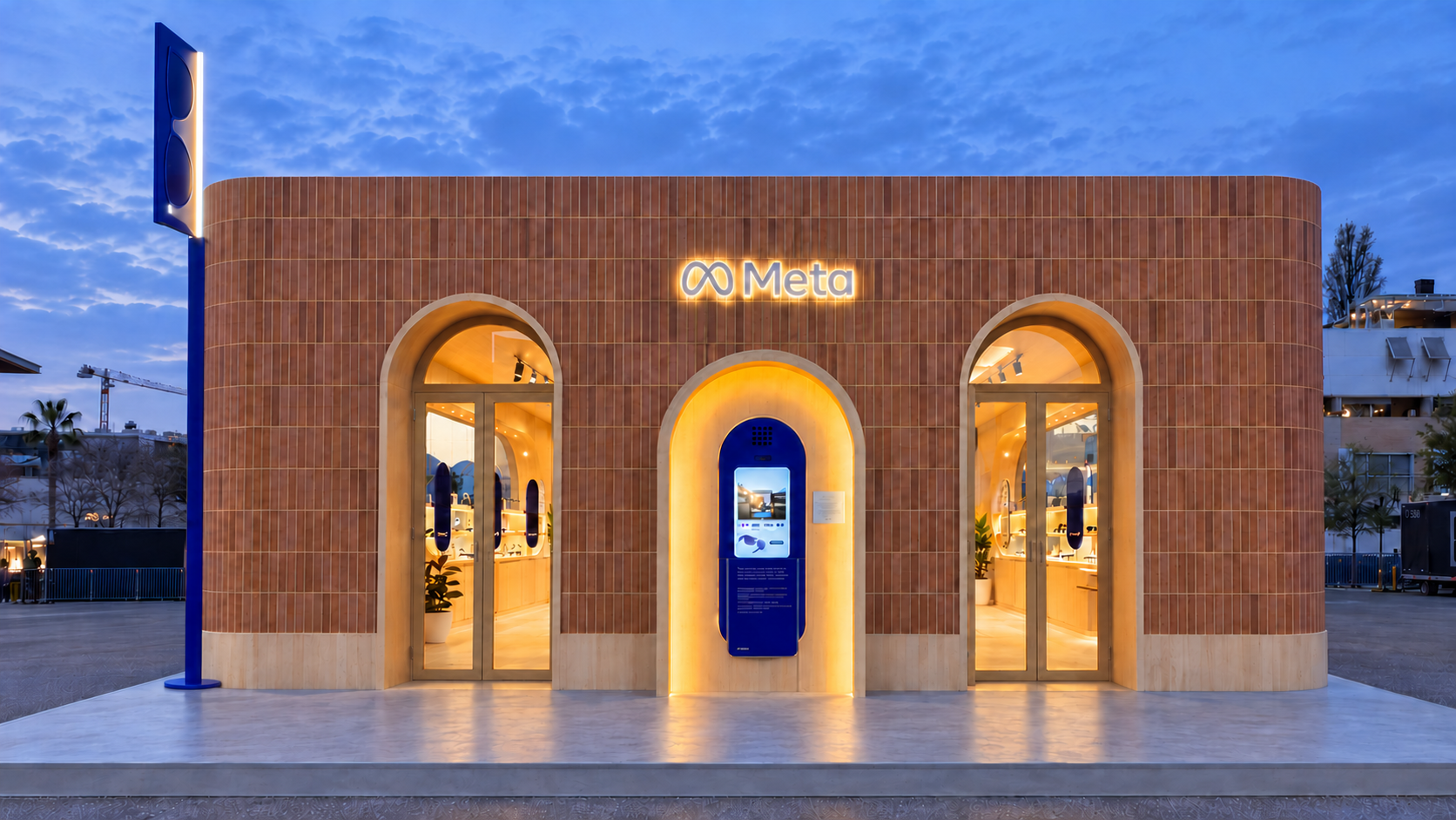 Front view of the ceramic facade of the Meta pavilion at MWC Barcelona 2026 with two arched entrances and an illuminated central niche