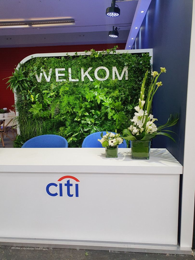 Stand de Citi en Money20/20 Europe 2024 en RAI Amsterdam con identidad corporativa y área de atención