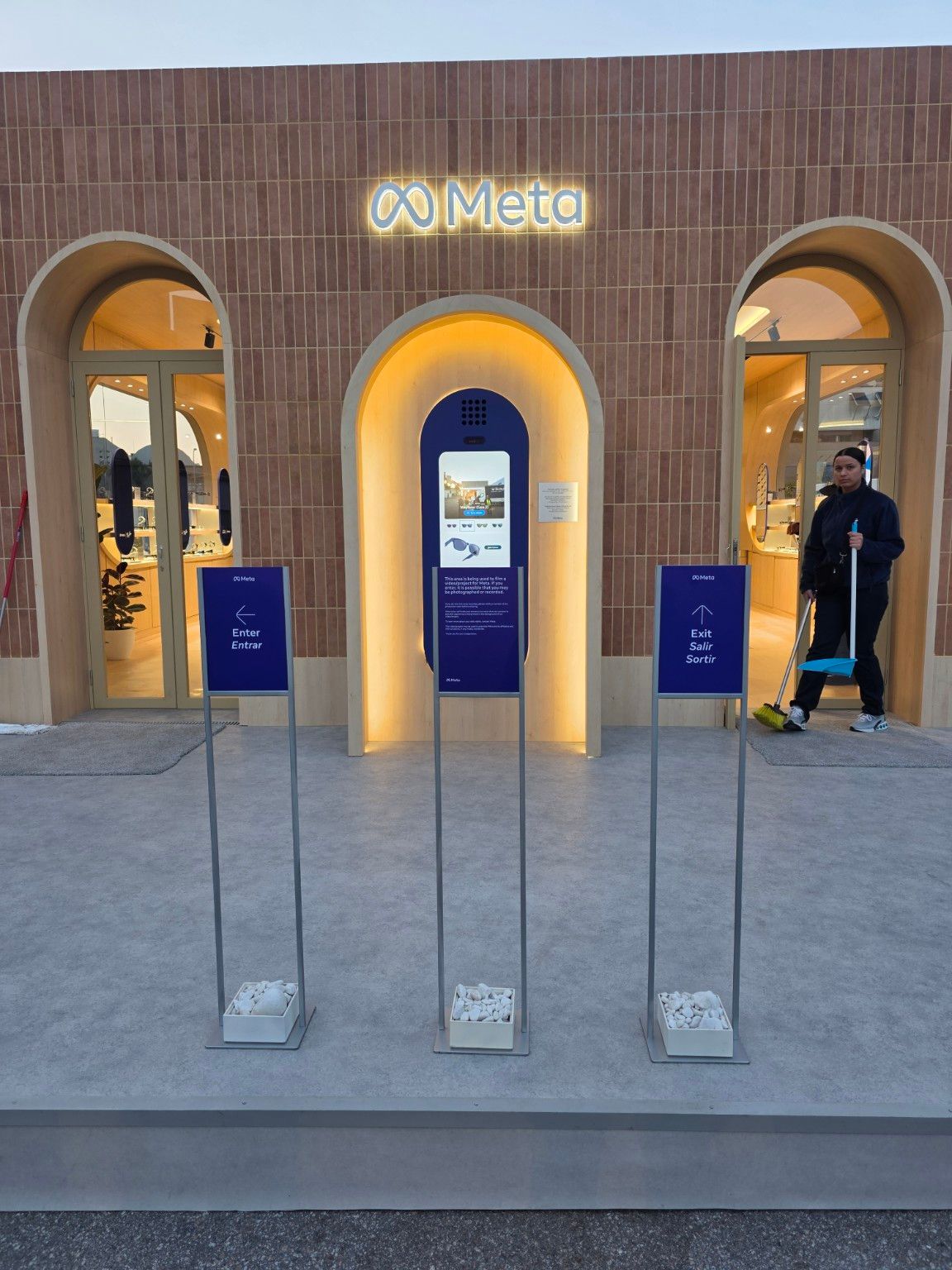 Meta pavilion entrance and exit with wayfinding signs and central terminal