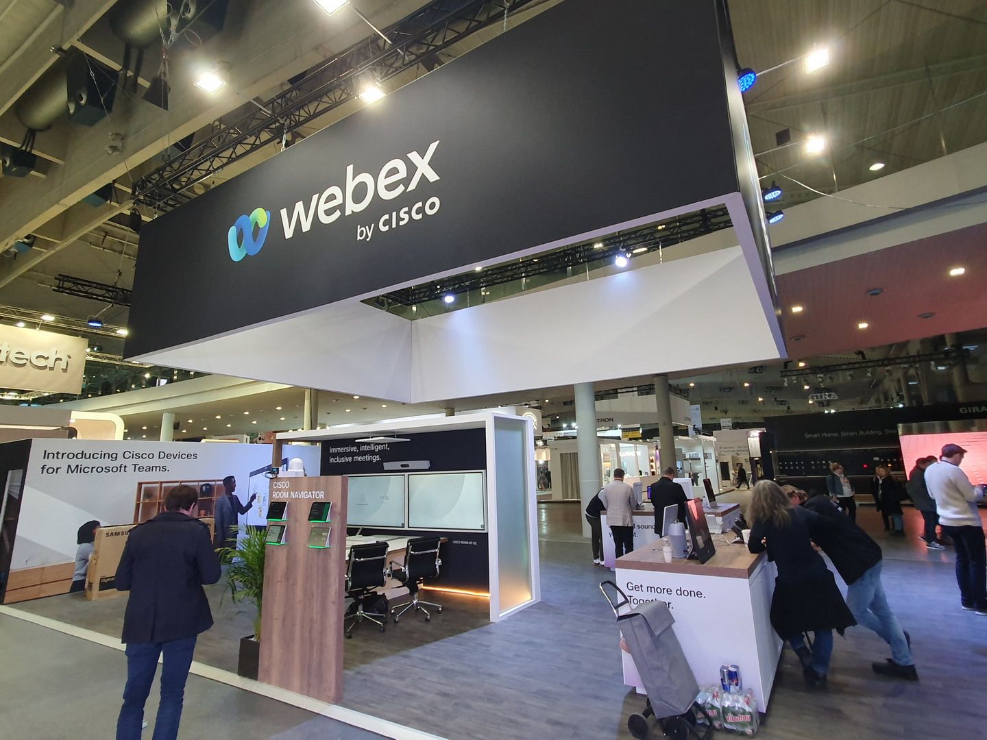 Elevated branding structure above the open space — Cisco Webex · ISE