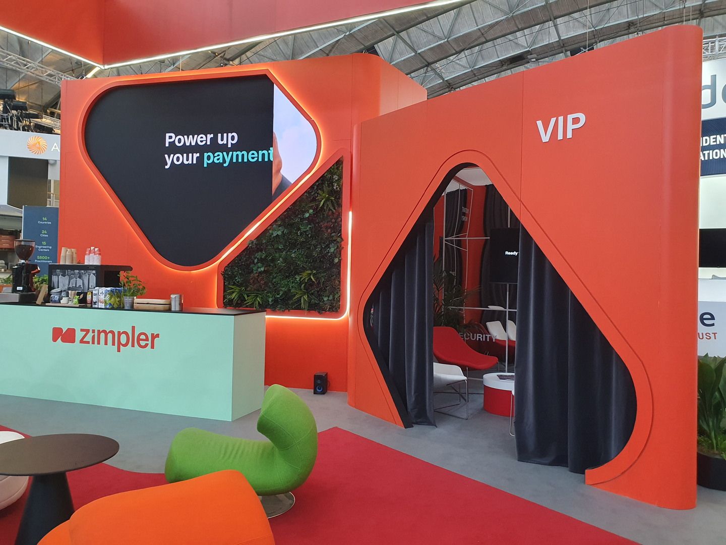 Zimpler stand at Money20/20 Europe 2023 in Amsterdam with red-and-black architecture and integrated lighting