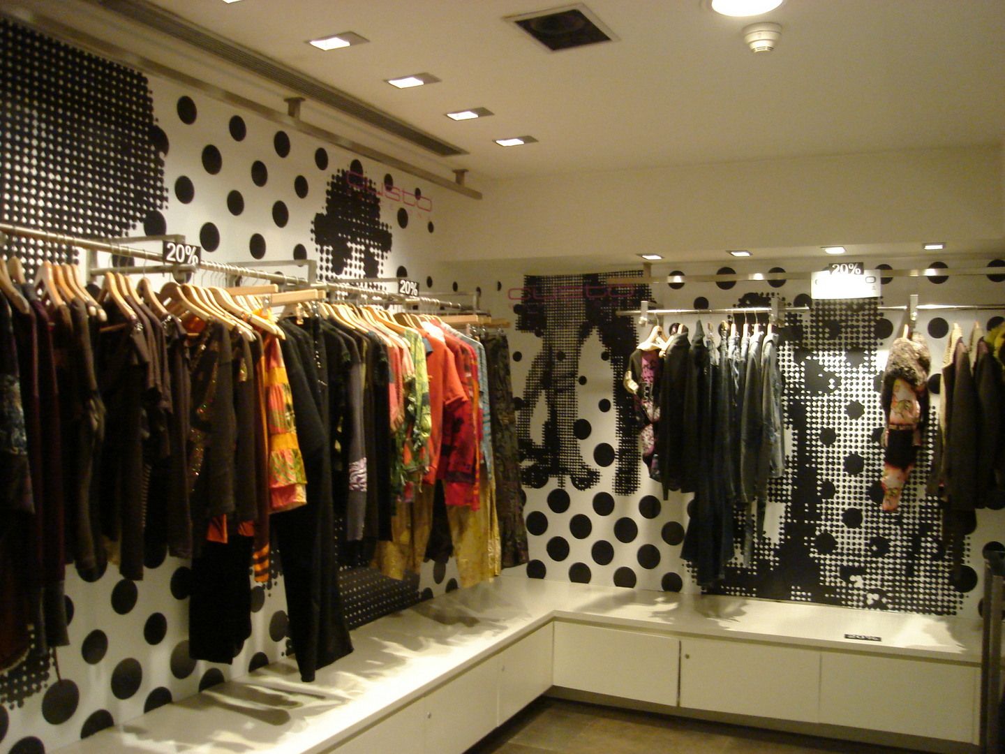 Custo Barcelona store interior with black-and-white wall graphics and fashion display