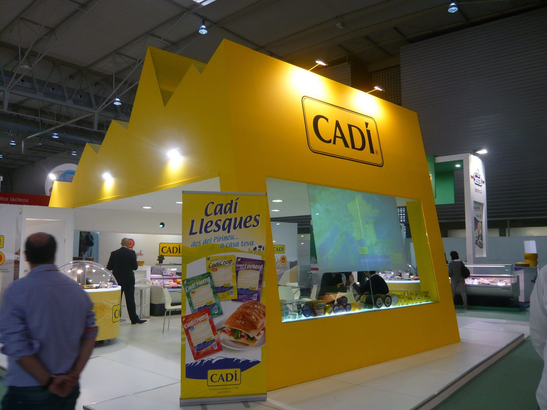 Cadí stand entrance with product graphics — Quesos Cadí · Alimentaria