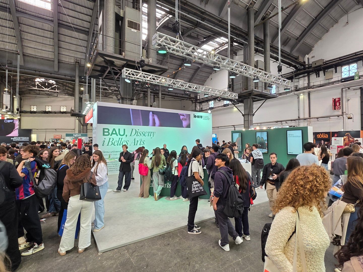 Reception area with visitors. BAU, Saló de l’Ensenyament 2026, Barcelona.