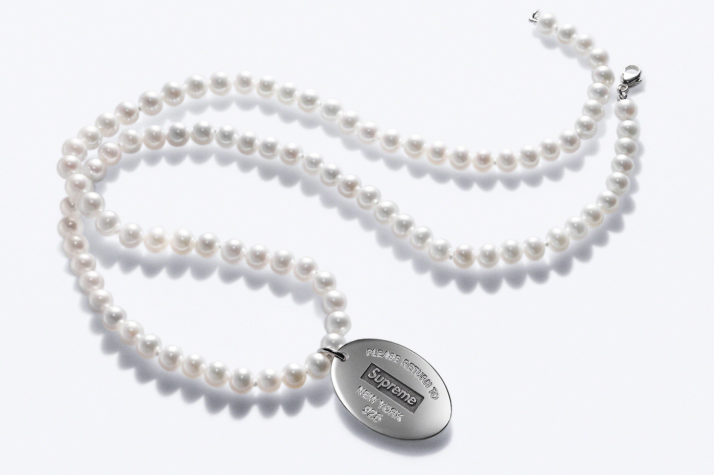 Return to Tiffany Oval Tag Pearl Necklace. Freshwater cultured pearls with sterling silver tag and clasp. 20”. (9/16)