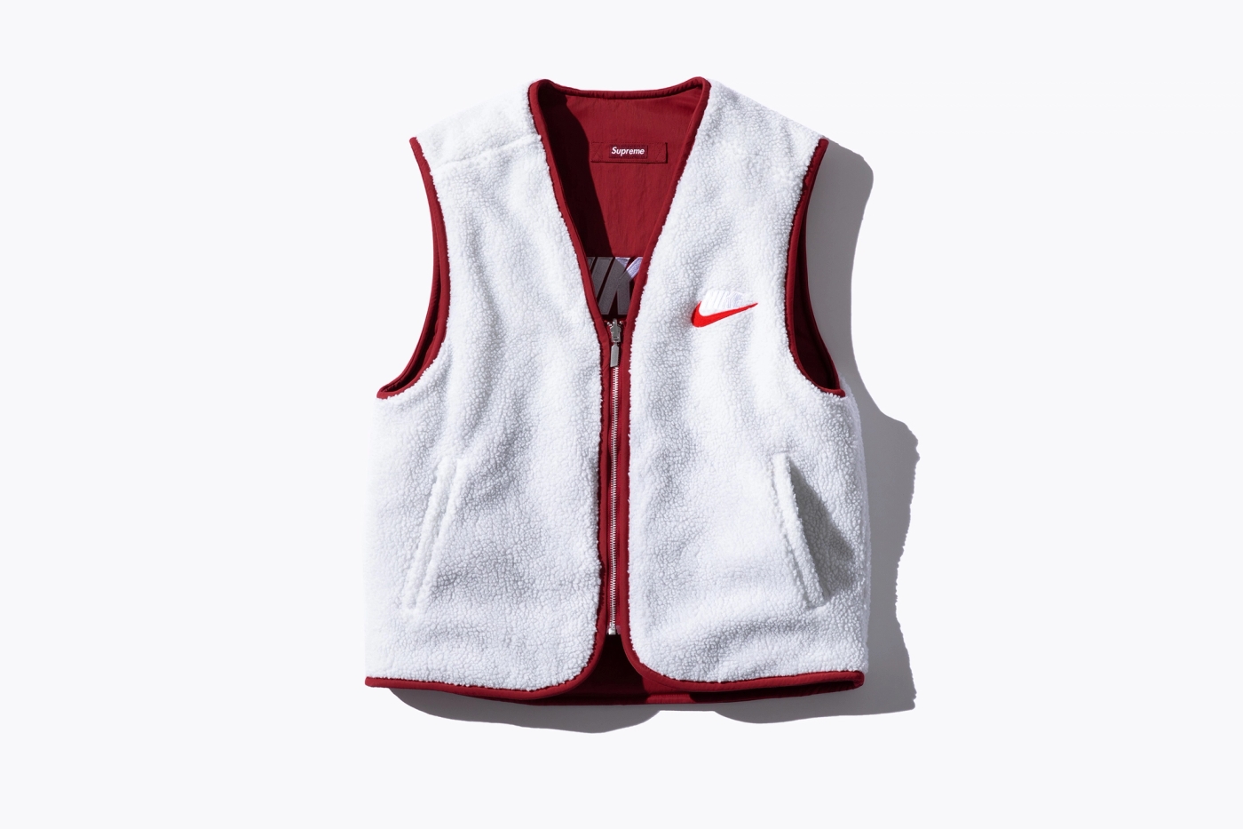 Reversible Nylon Vest with sherpa fleece lining and embroidered logos. (19/38)