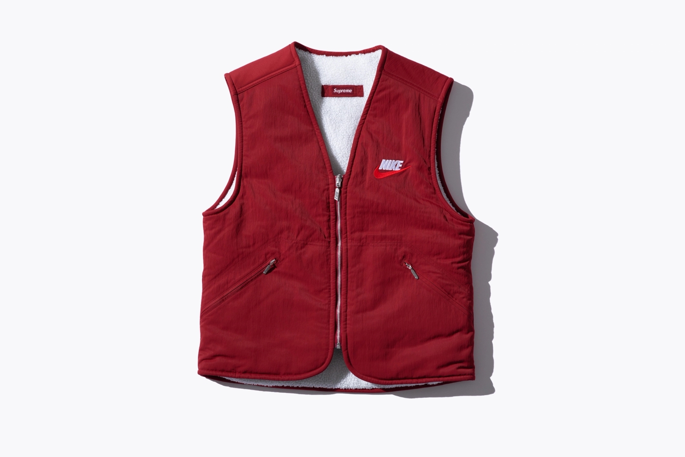 Reversible Nylon Vest with sherpa fleece lining and embroidered logos. (17/38)