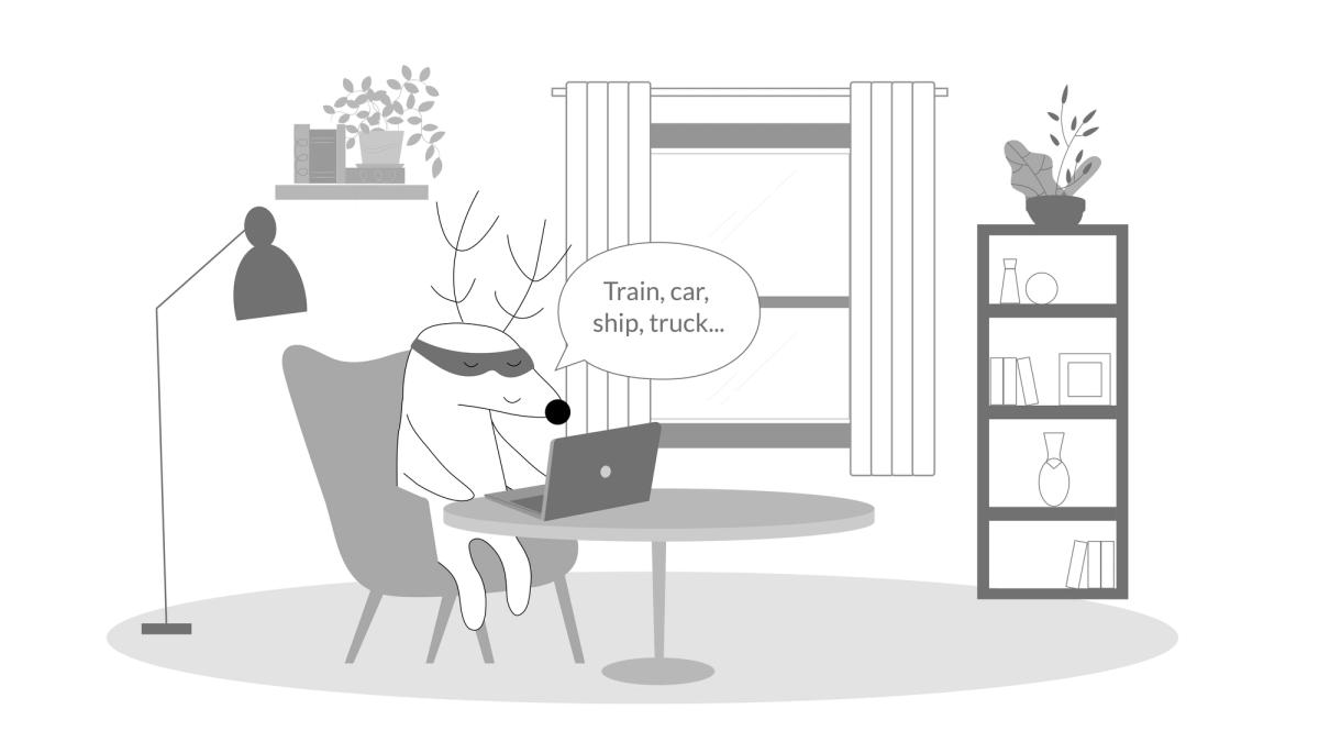Soren sitting at a desk, saying “train, car, ship, truck…”