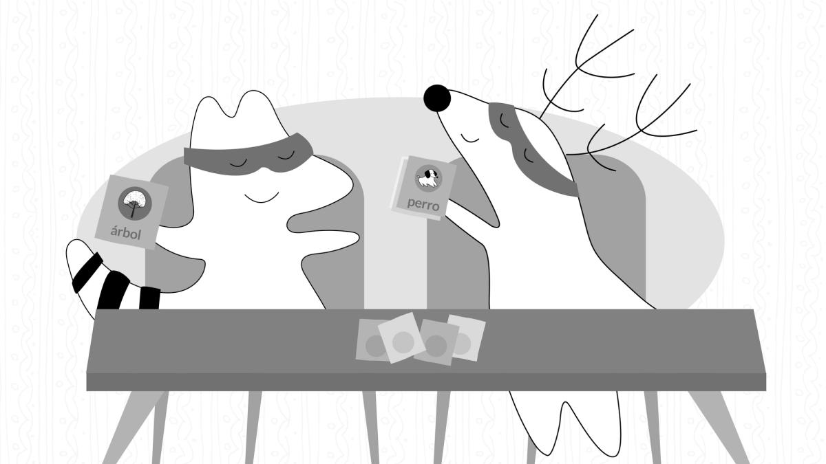 Soren is sitting down at a desk, studying while crafting flashcards with drawings for perro (dog) and árbol (tree).
