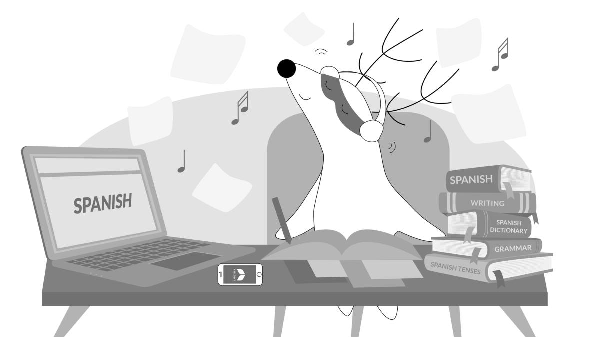 Soren is sitting at his desk studying with books, a smartphone, a laptop, and music in his headphones.