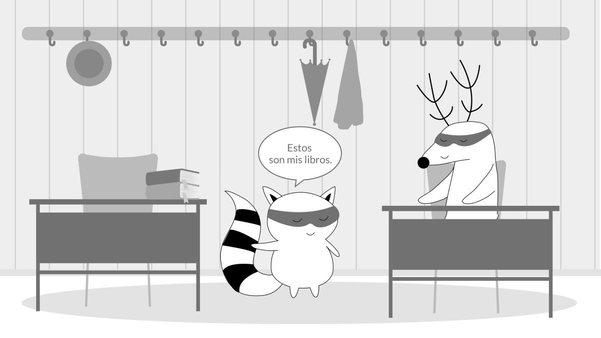 Benji is in the classroom, pointing out at his books and saying, "Estos son mis libros."