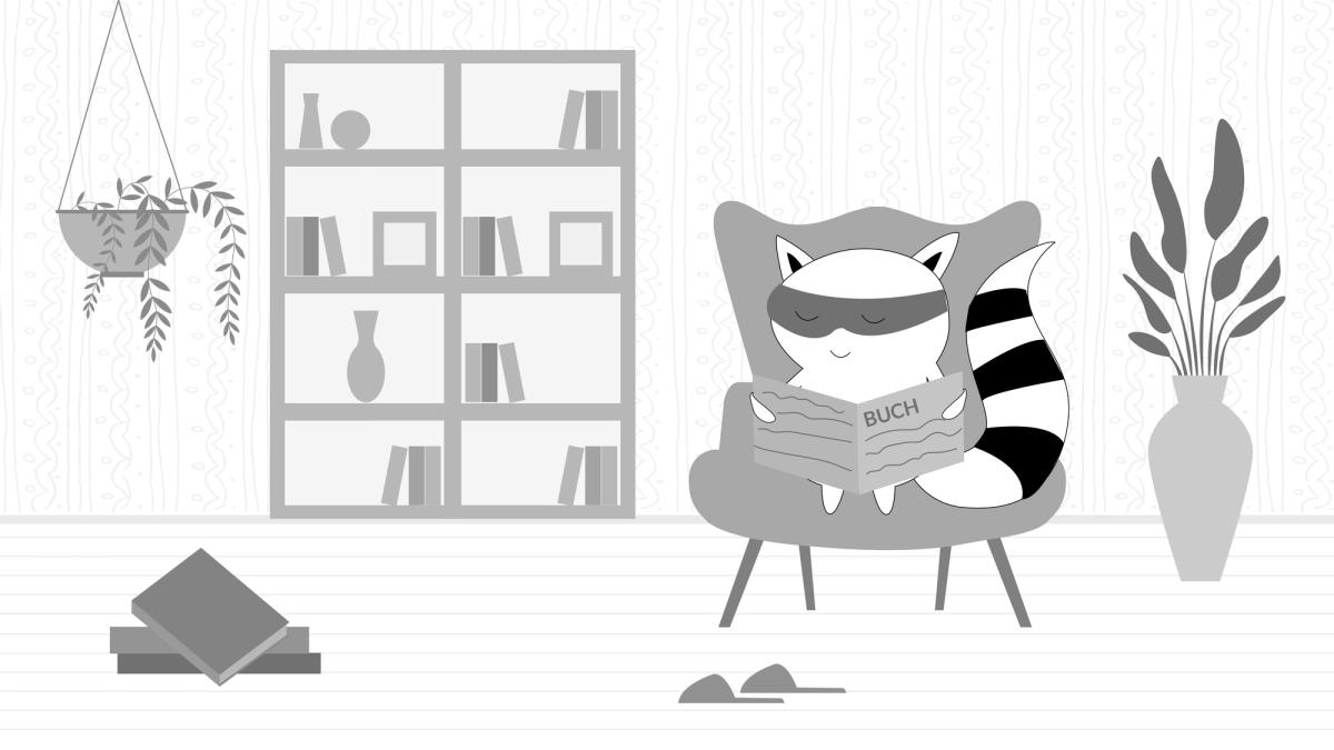Soren is at home, sitting in a comfy chair, reading a book.