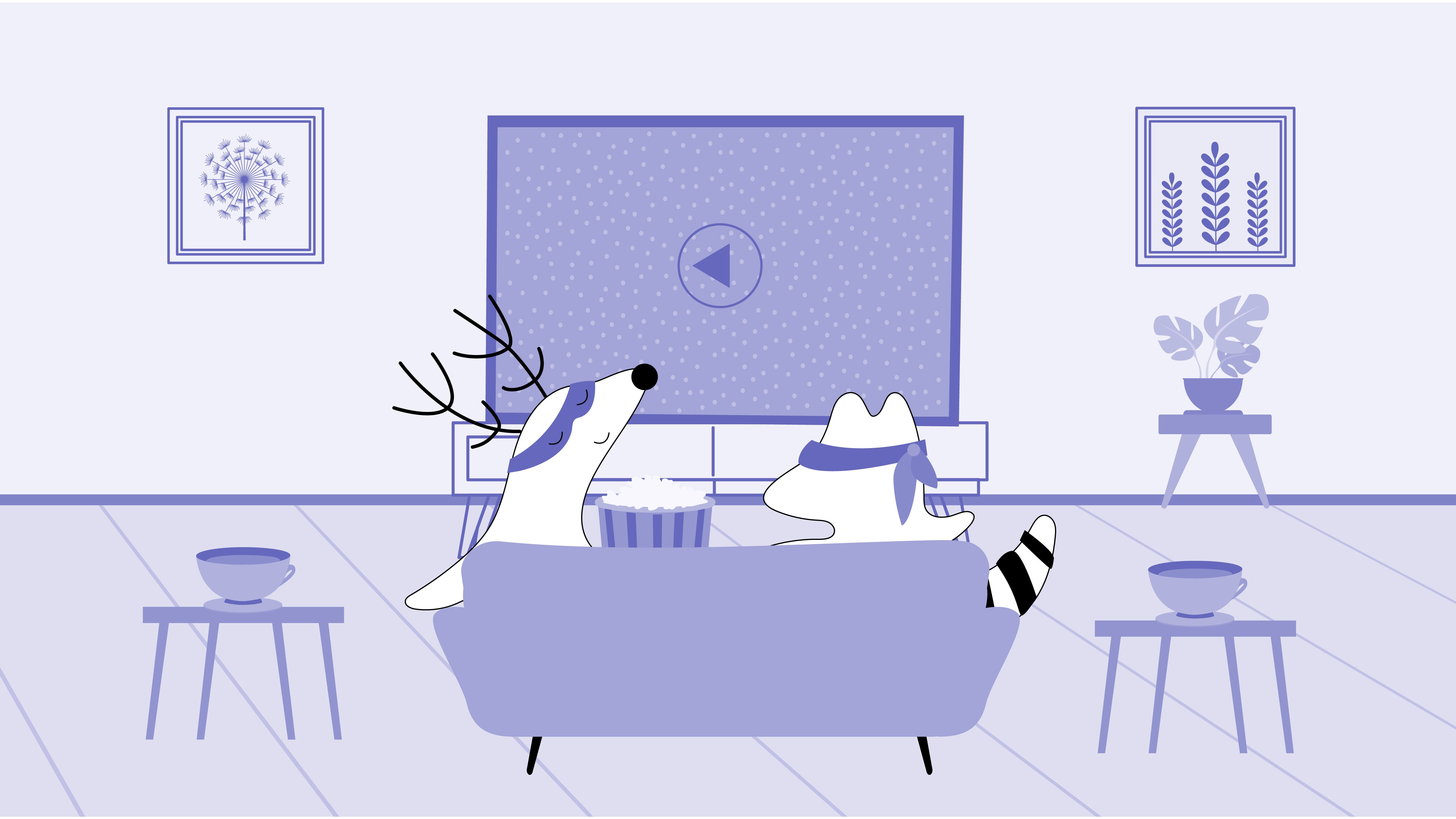 Soren and Iggy are sitting on the couch, watching a movie, and eating popcorn