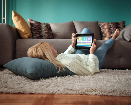 woman relaxing with tablet