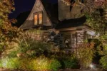 Landscape uplighting around an old home