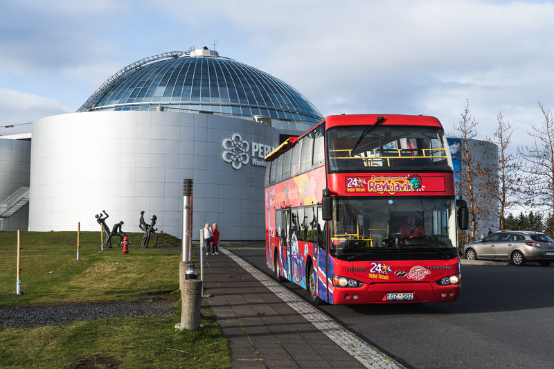 a red double decker bus with the number 24 on the front