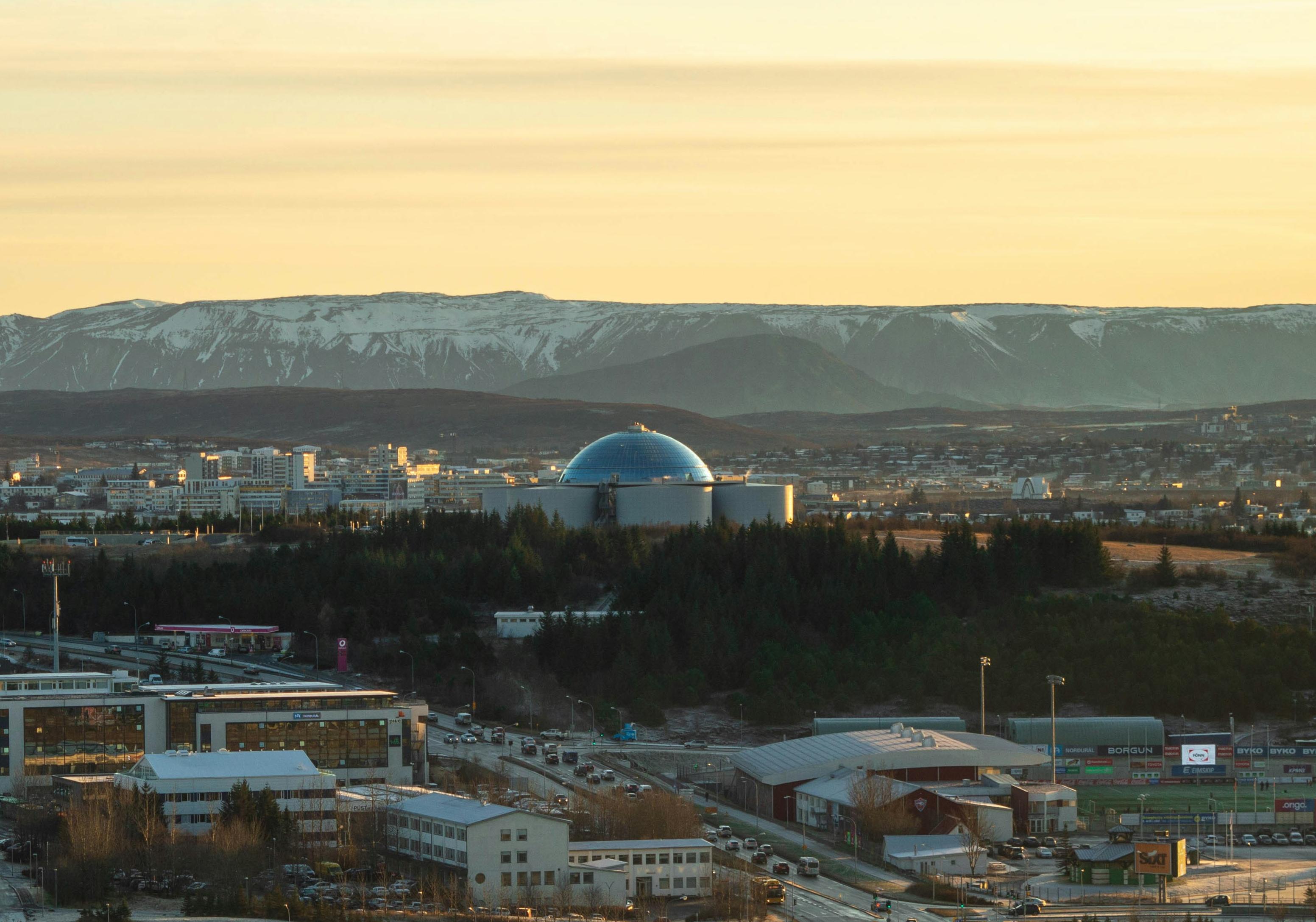 The glass dome of Perlan rising above the skyline in Reykjavík