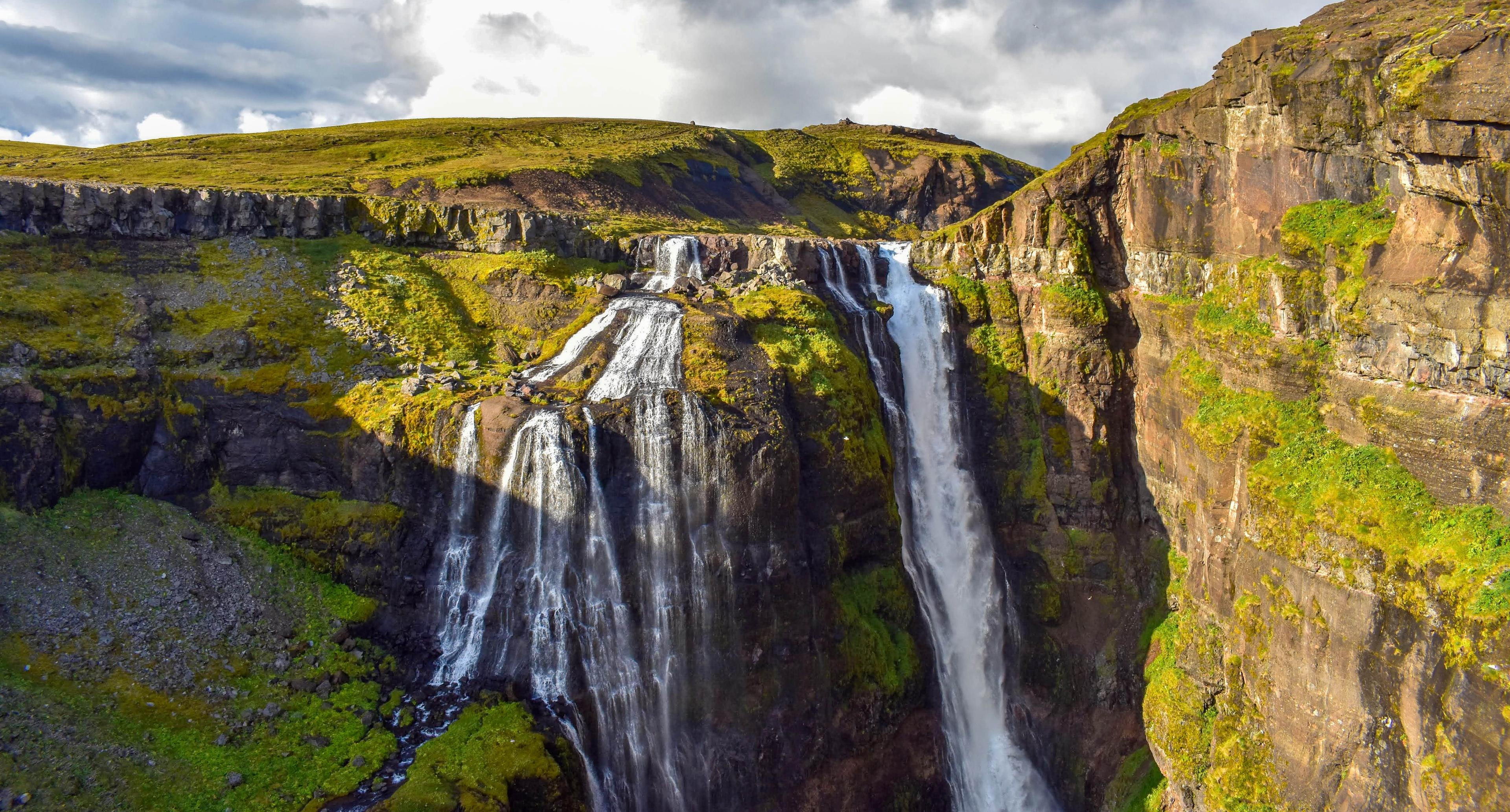 Beautiful waterfall in vibrant natural settings on a sunny day
