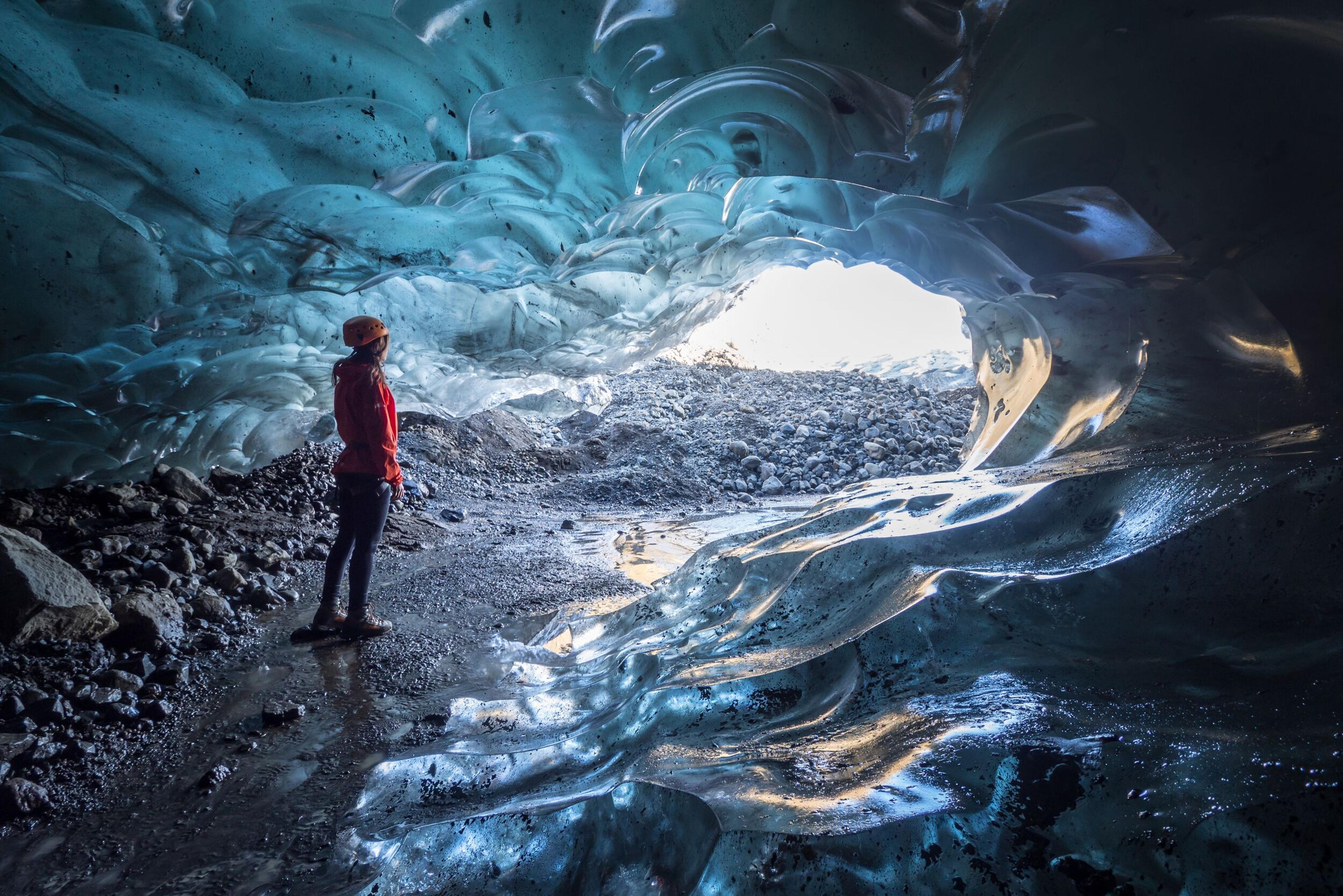 Explorer inside an ice cave in Iceland.