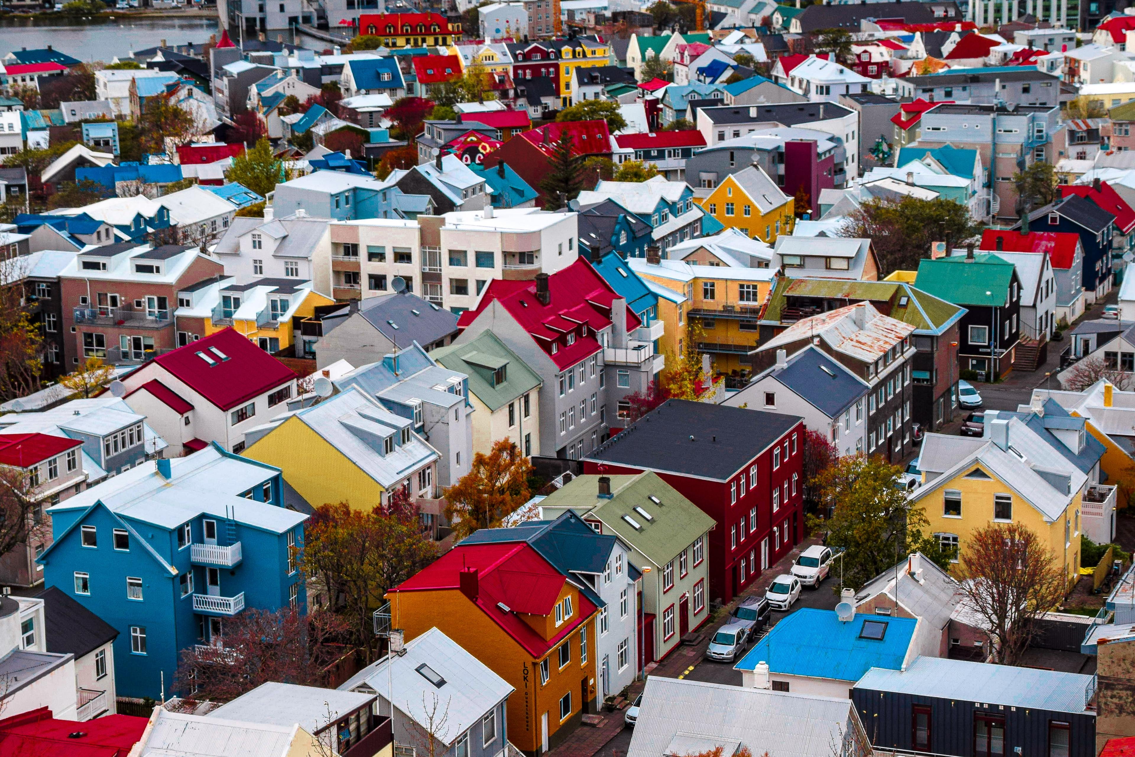 Aerial view of vibrantly colorful houses dotting the downtown area of Reykjavík.