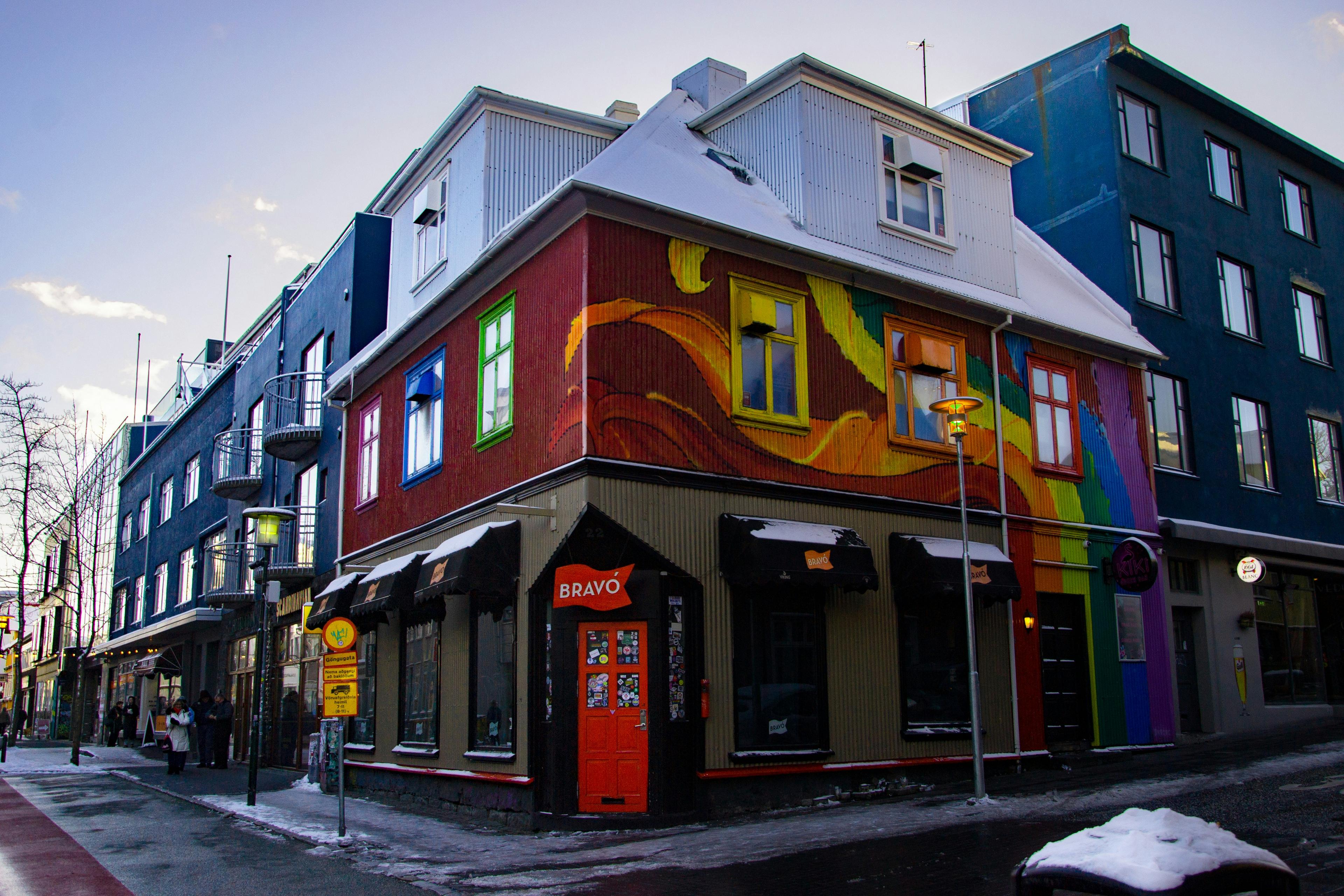 Colorful building with rainbow mural in Reykjavik, highlighting Pride celebrations.