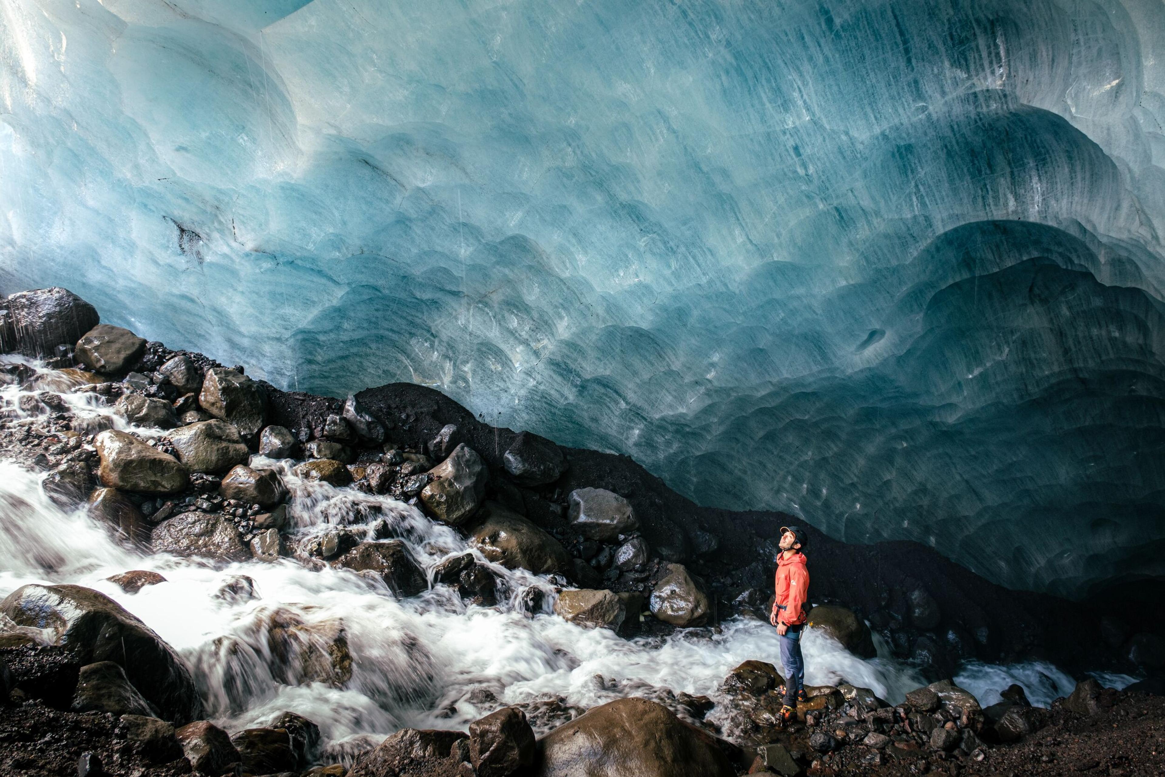 guide inside an ice cave in Skaftafell, Iceland