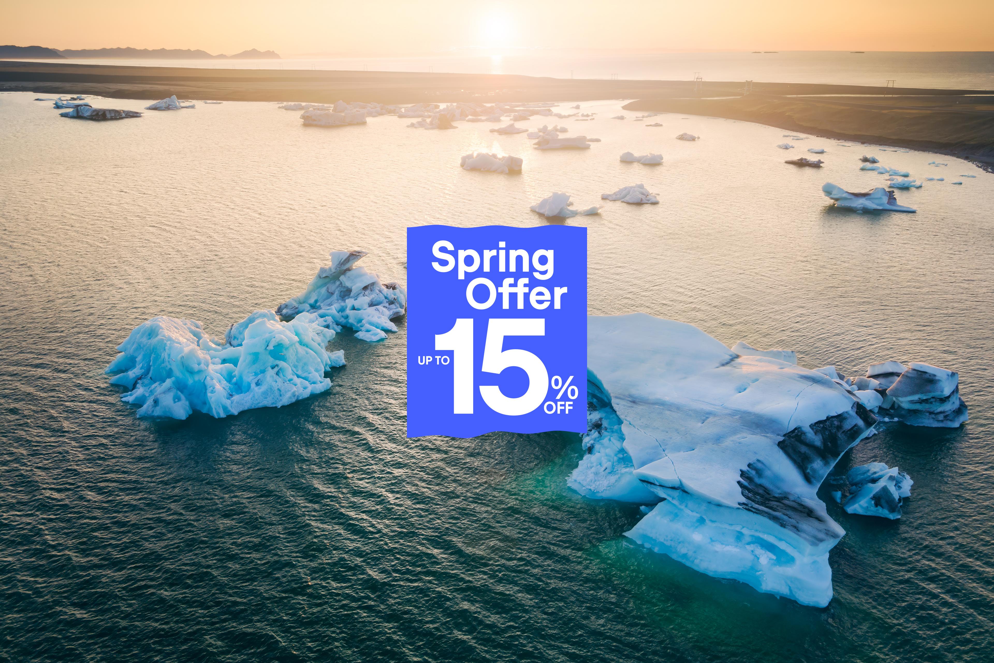 Icebergs floating in water at sunset with a blue "Spring Offer Up To 15% Off" banner overlaid.
