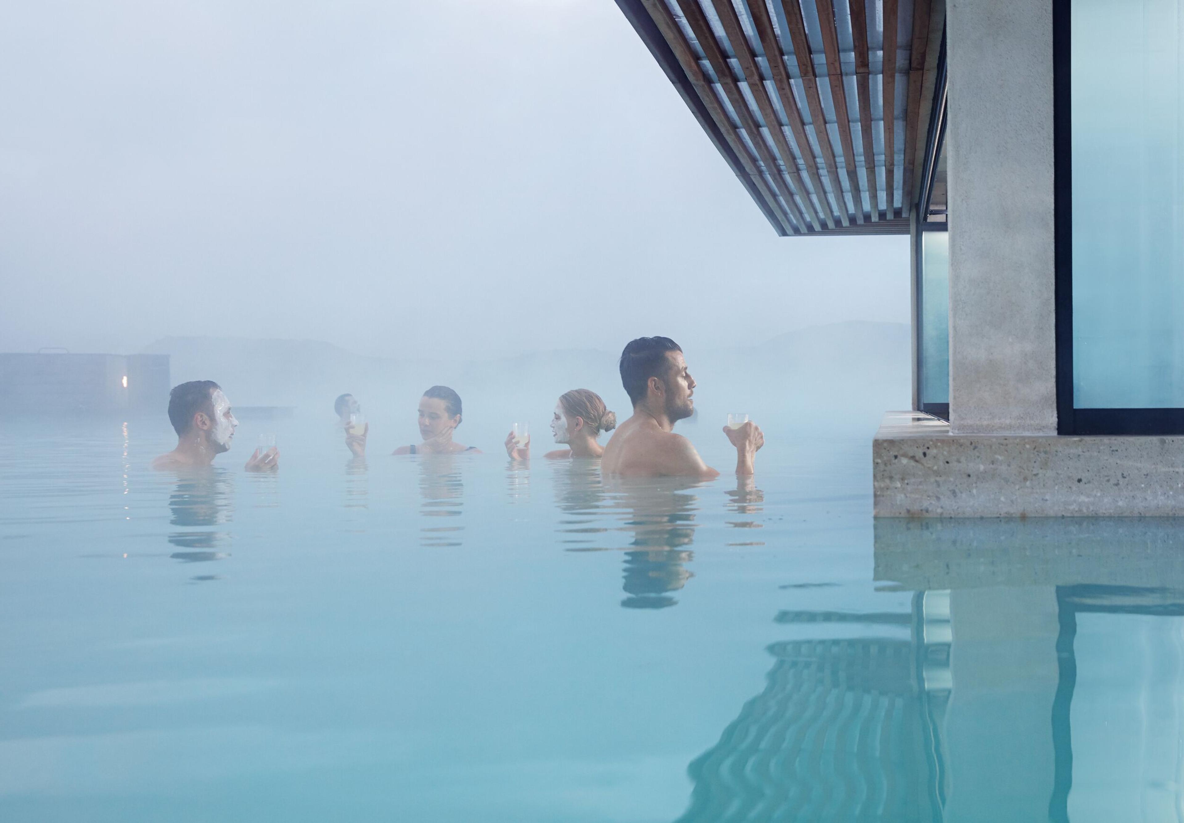 A group of people relaxing by the bar at Blue Lagoon, Iceland.