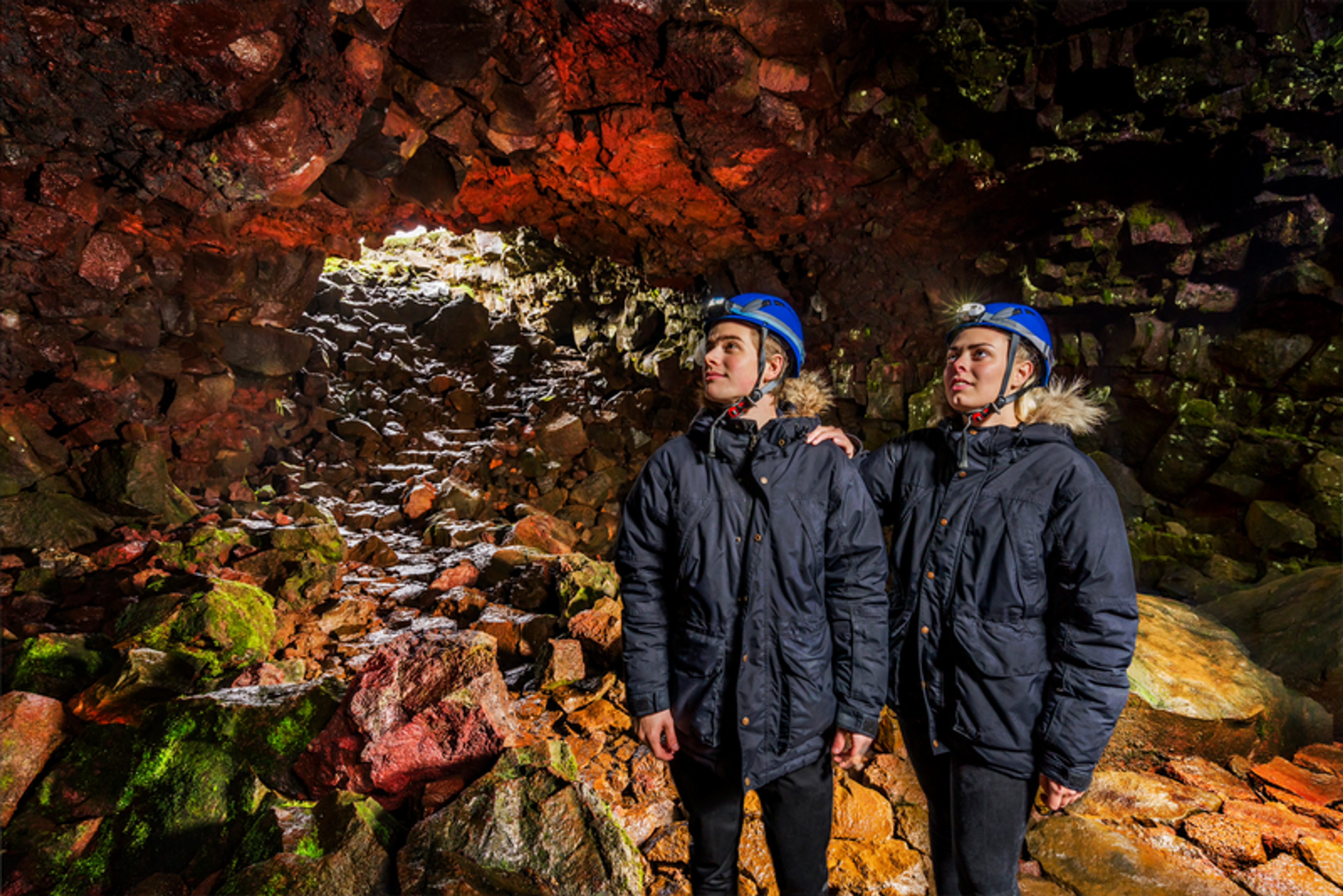 Two people inside the Lava tunnel in Iceland.