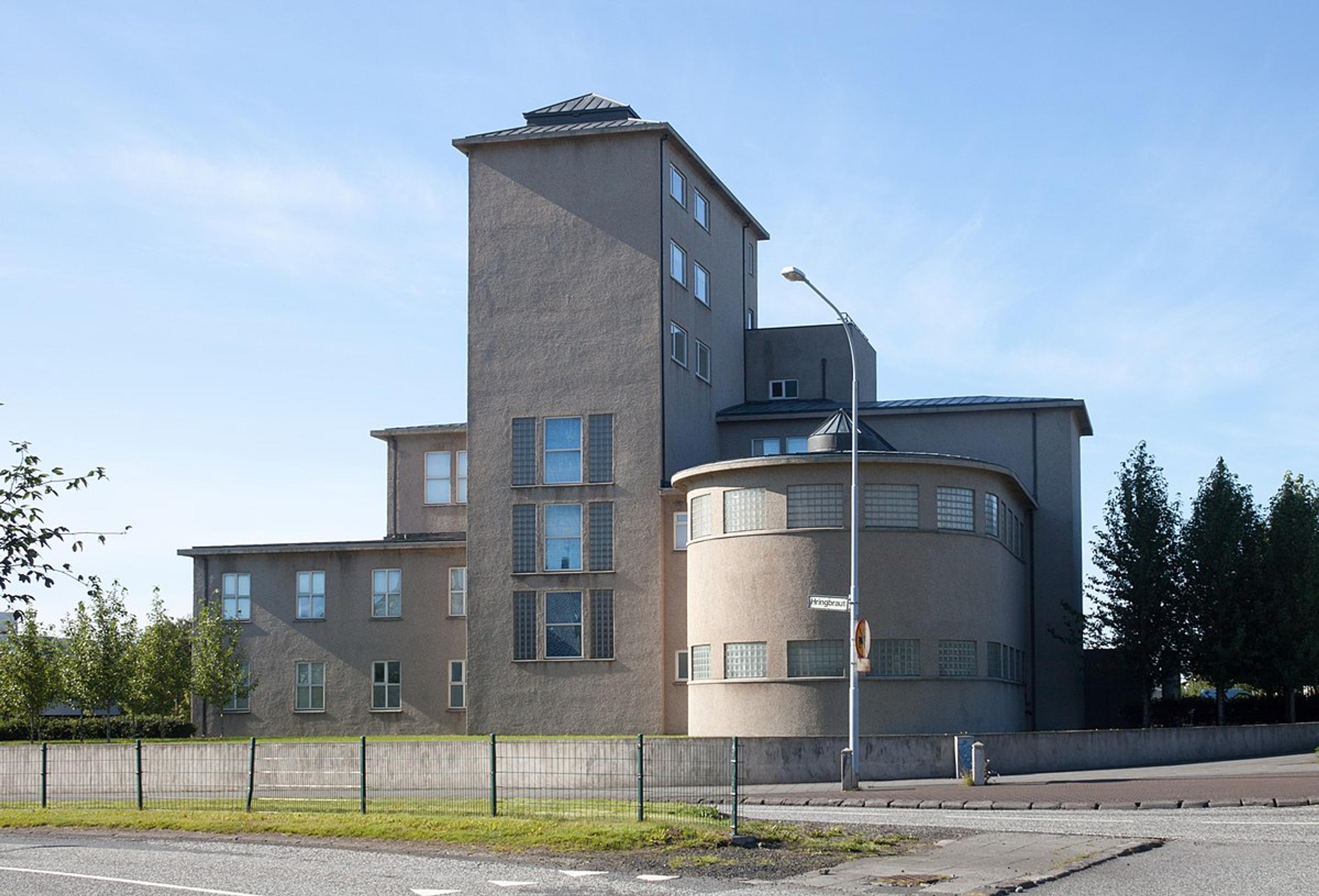 Exterior of the National Museum of Iceland, a minimalist concrete building with large windows.