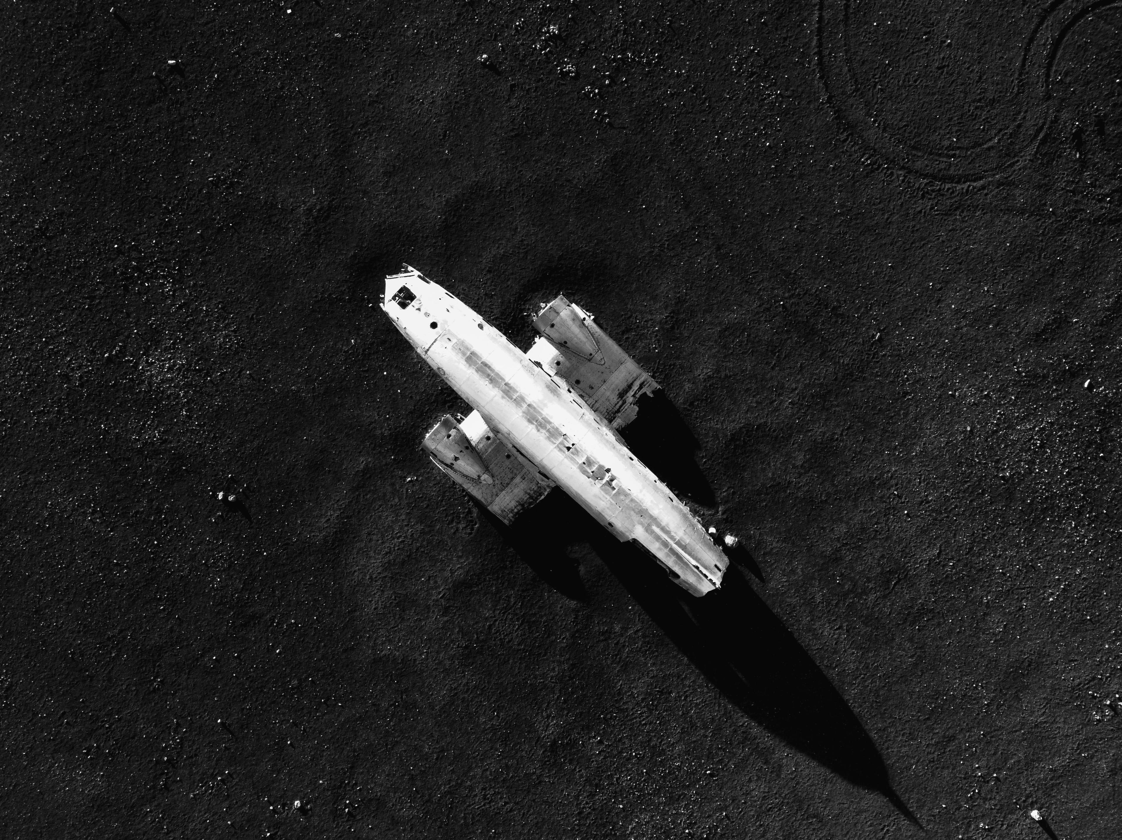 Aerial view of the plane wreck on the black sand
