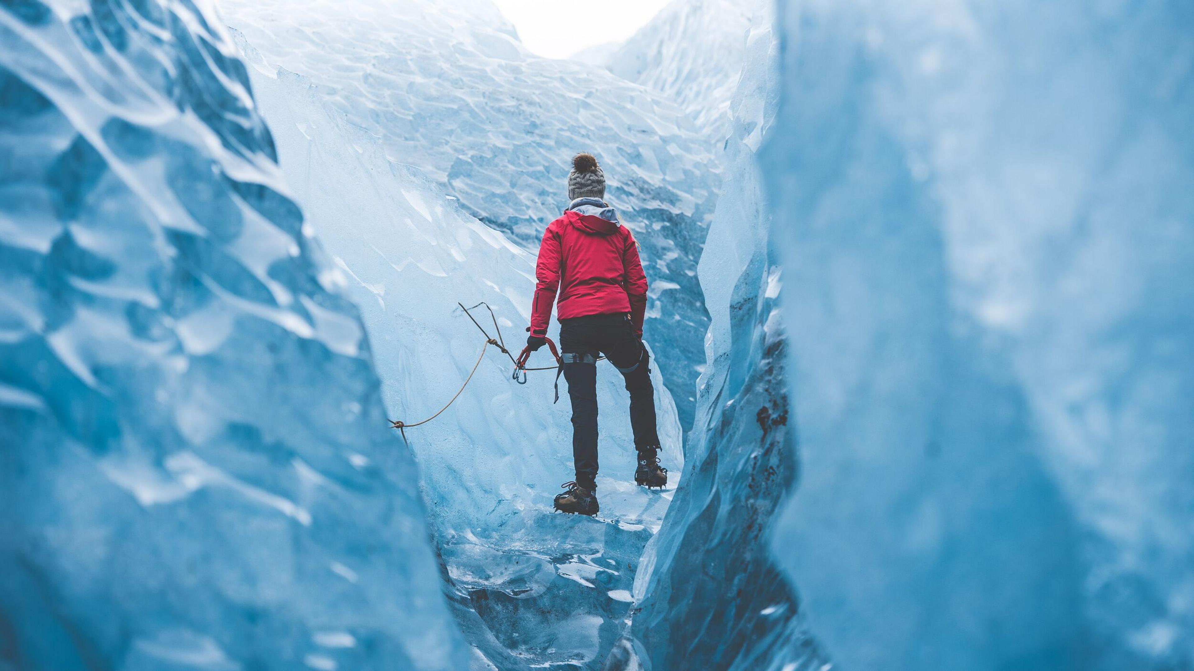 Person walking in glacer crevasse