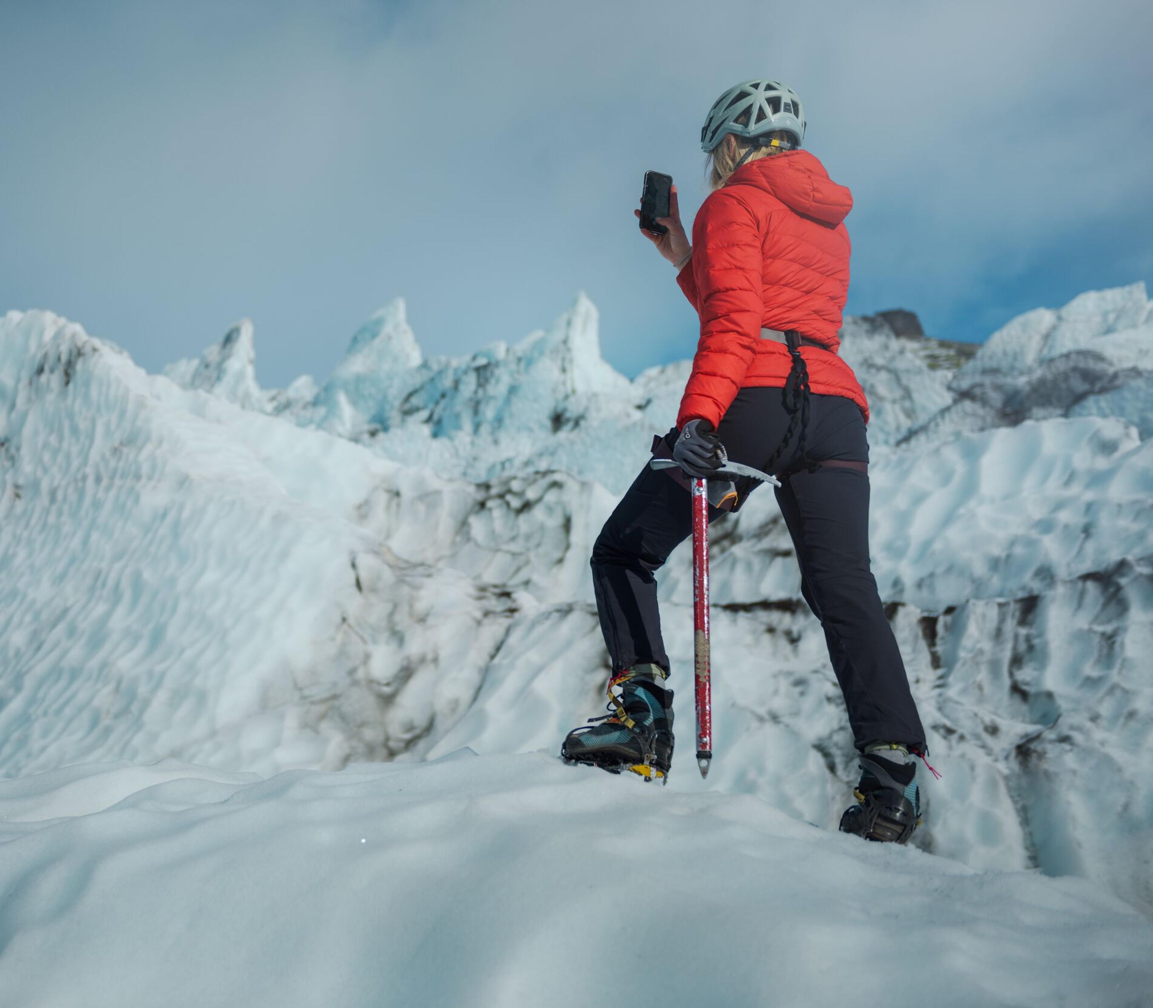 An explorer hiking on a glacier in Skaftafell.