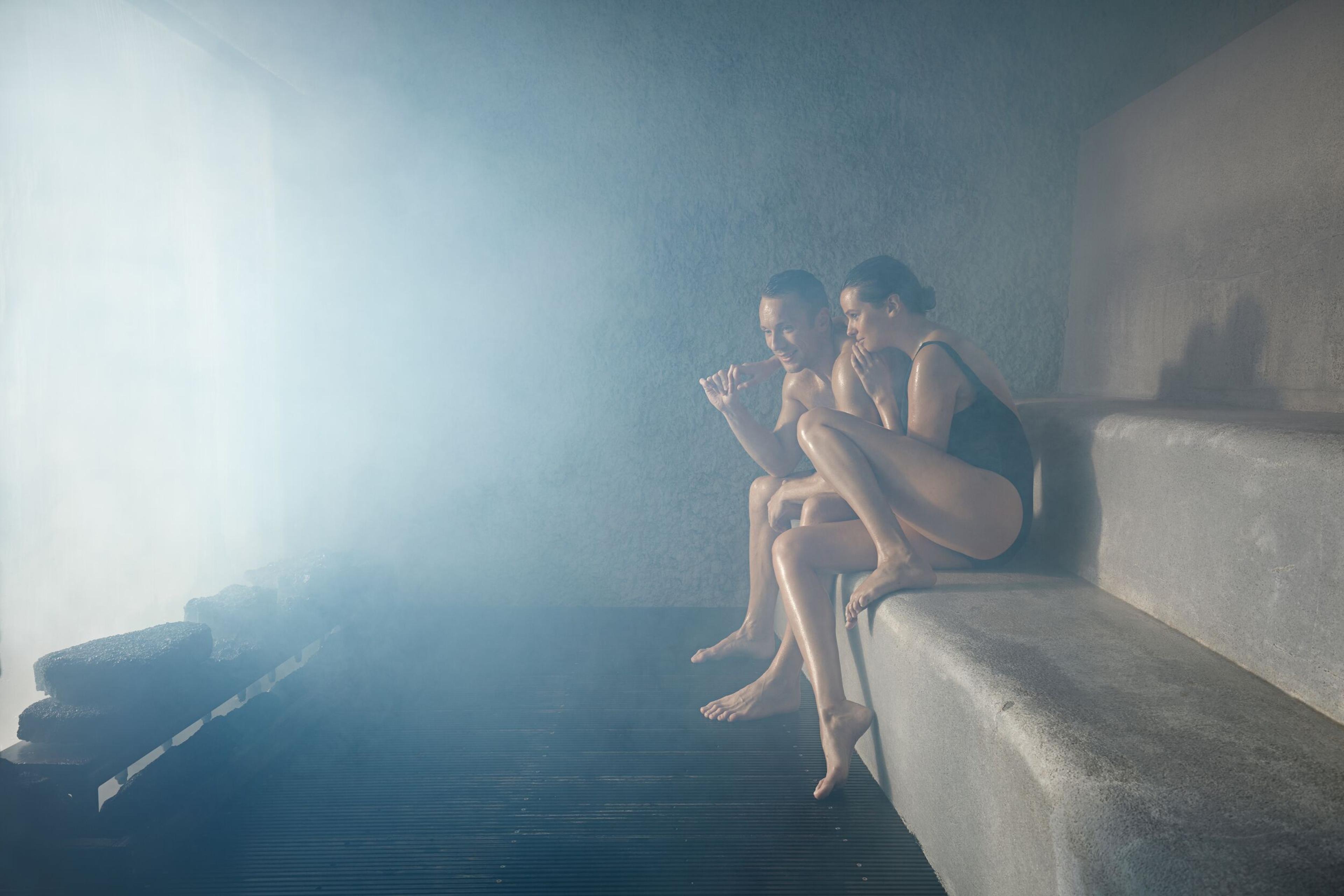 A couple relaxing at the sauna in Blue Lagoon, Iceland.