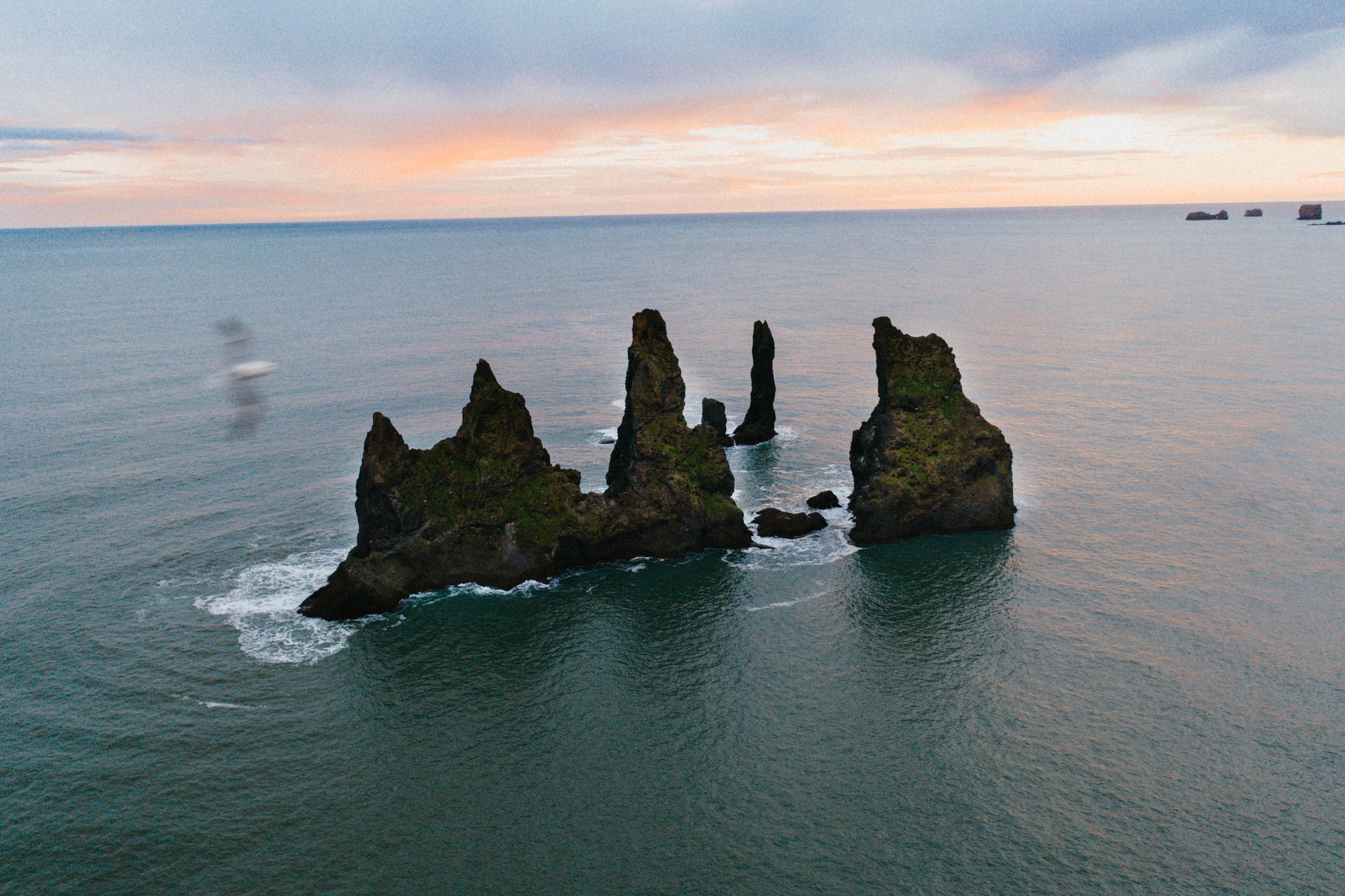 An aerial view of Reynisdrangar sea stacks