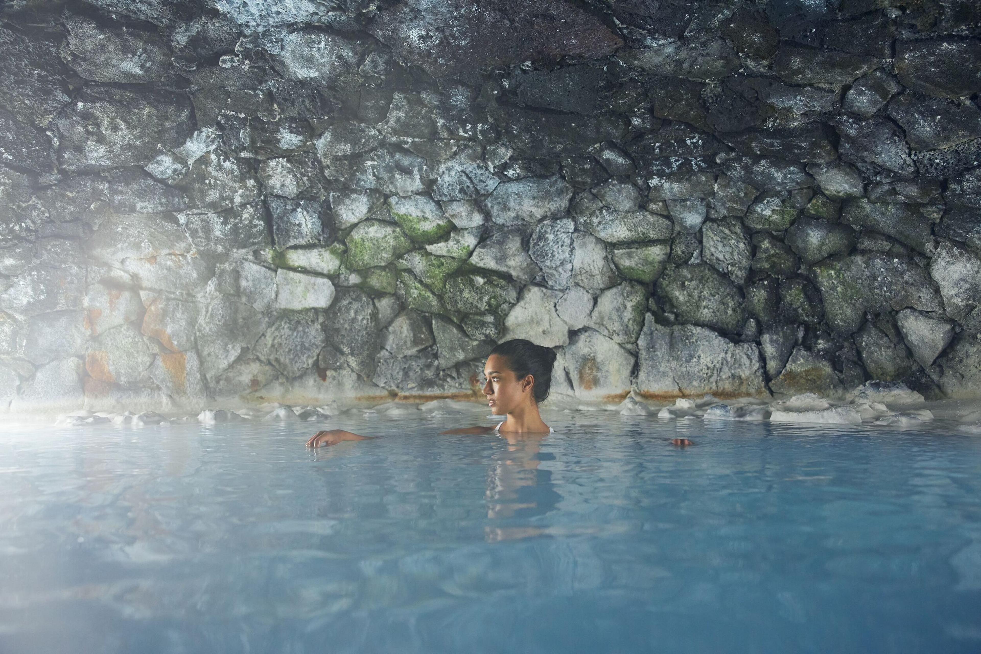 a woman inside man made cave at the Blue Lagoon