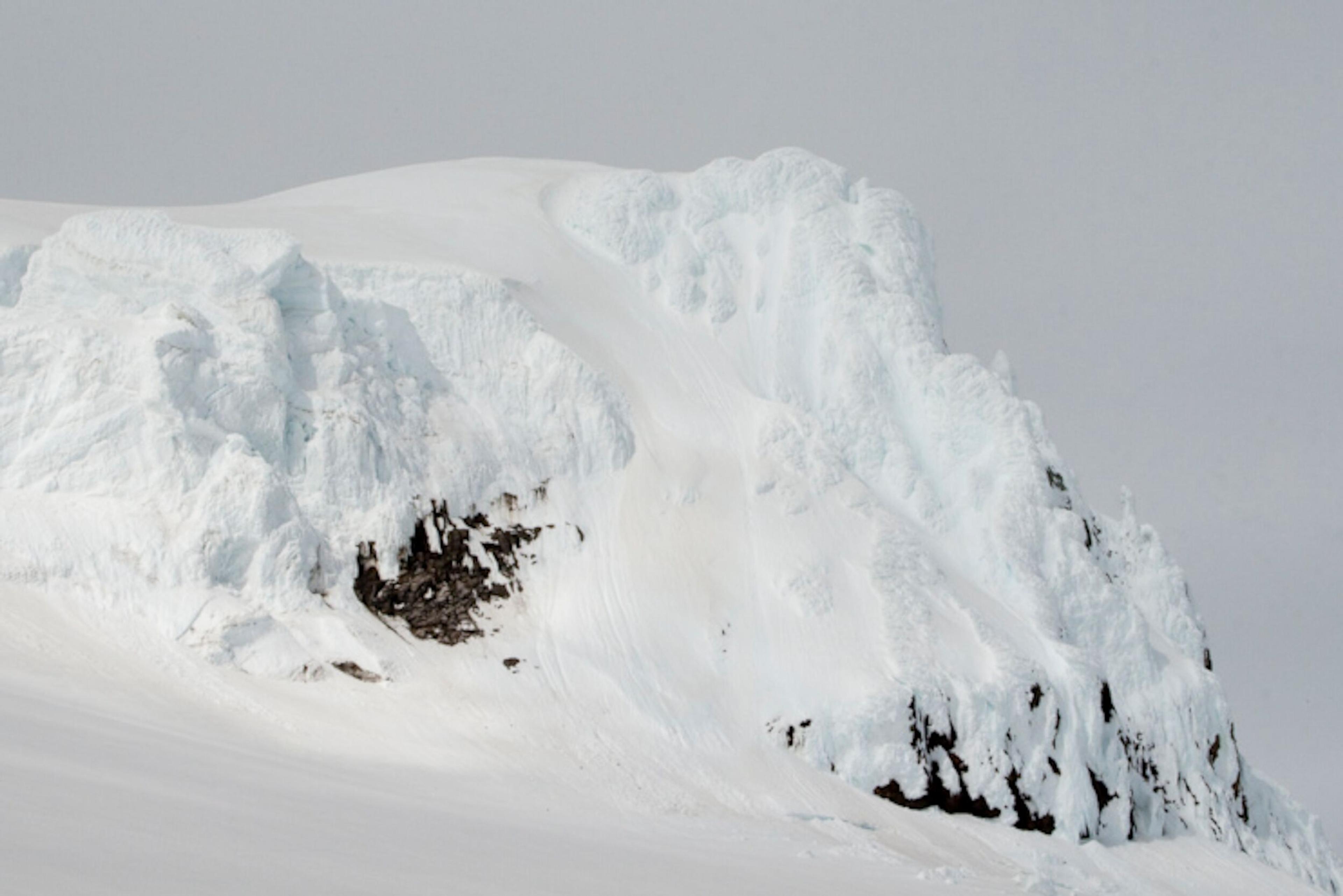 Close-up view of the rugged and snow-dusted summit of Hvannadalsnjúkur.