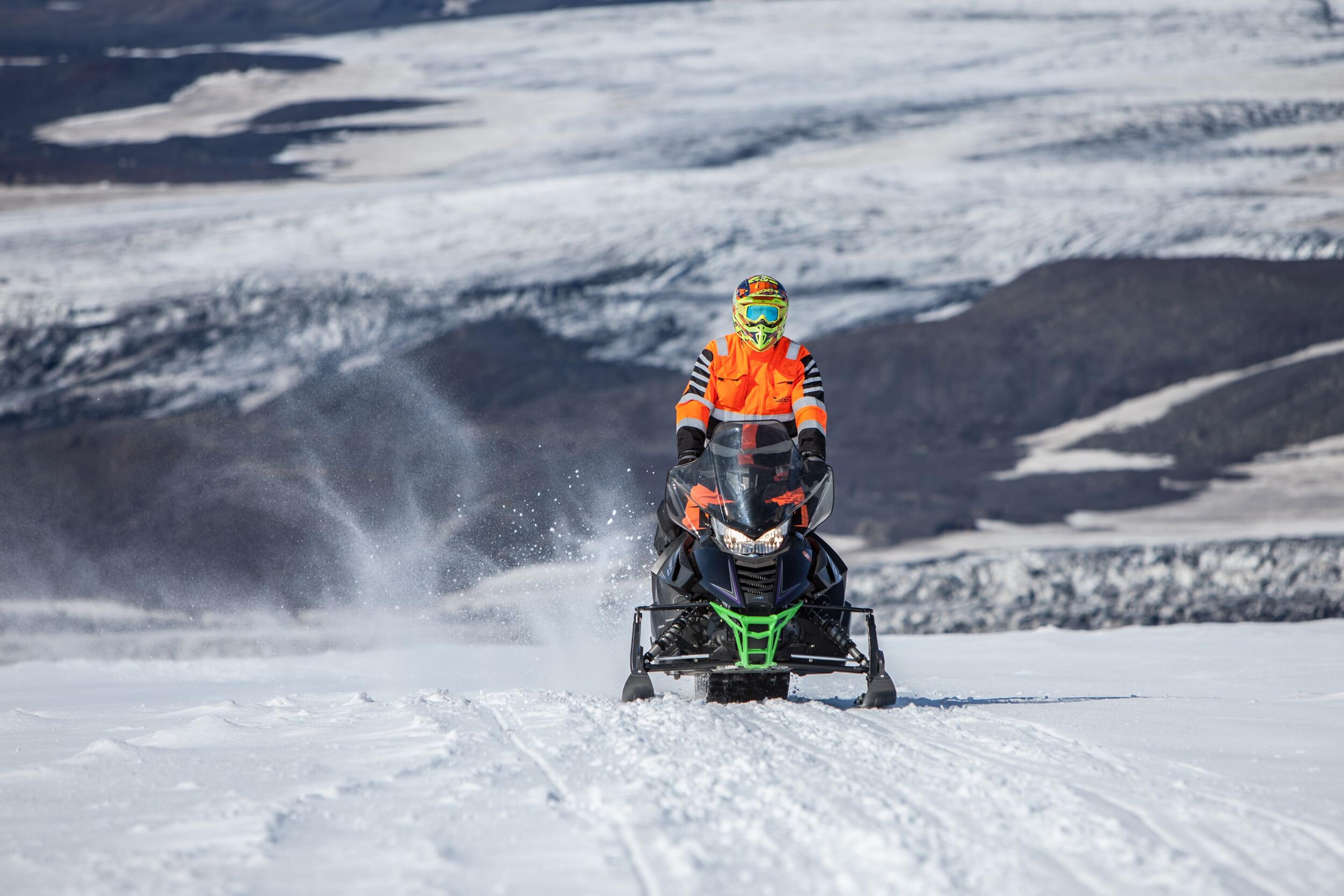 Snowmobile driving on Mýrdalsjökull Glacier in the south coast of Iceland.