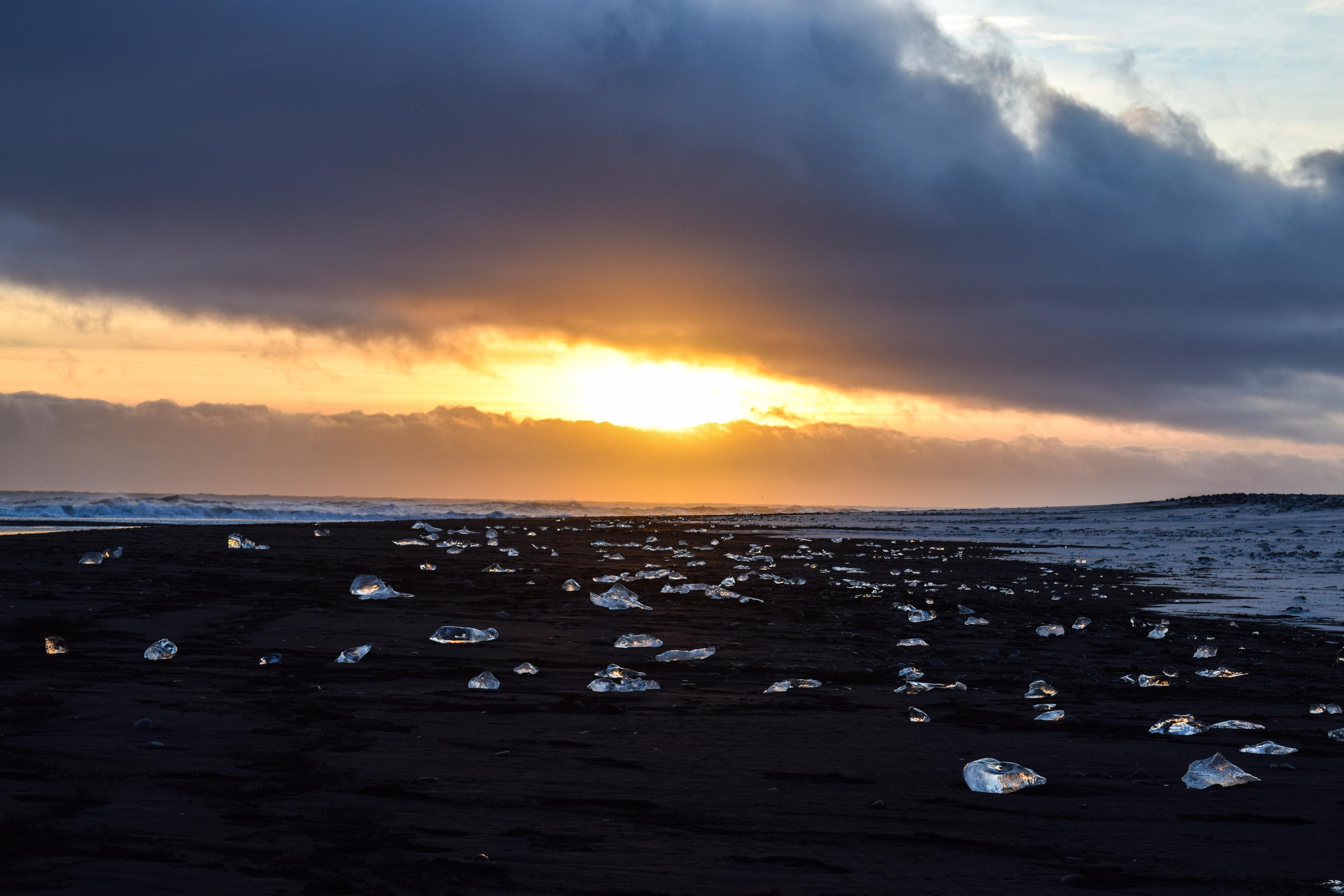 Icebergs ashore on the black sand of Diamond's beach.