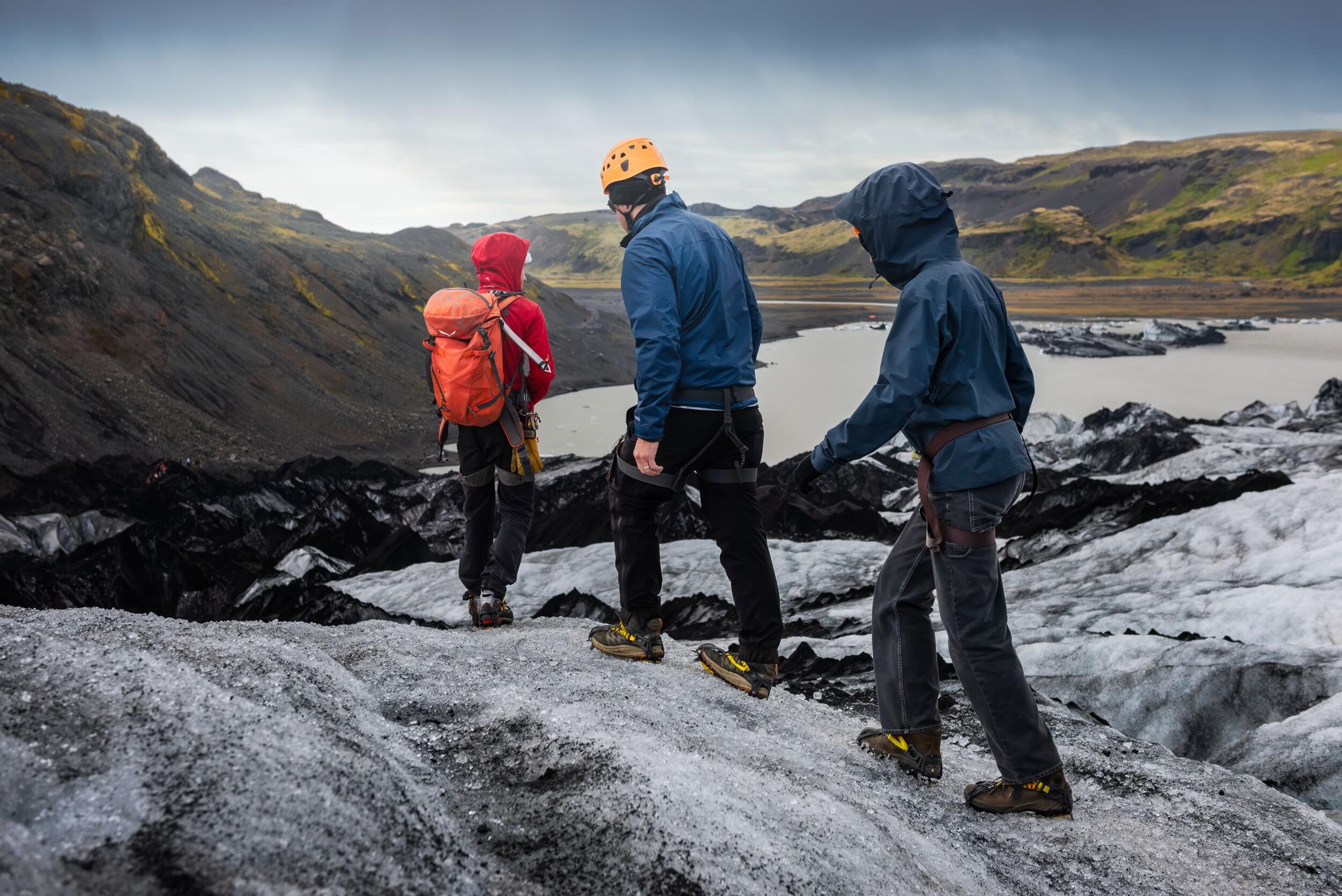 group of explorers hiking dowm a glacier