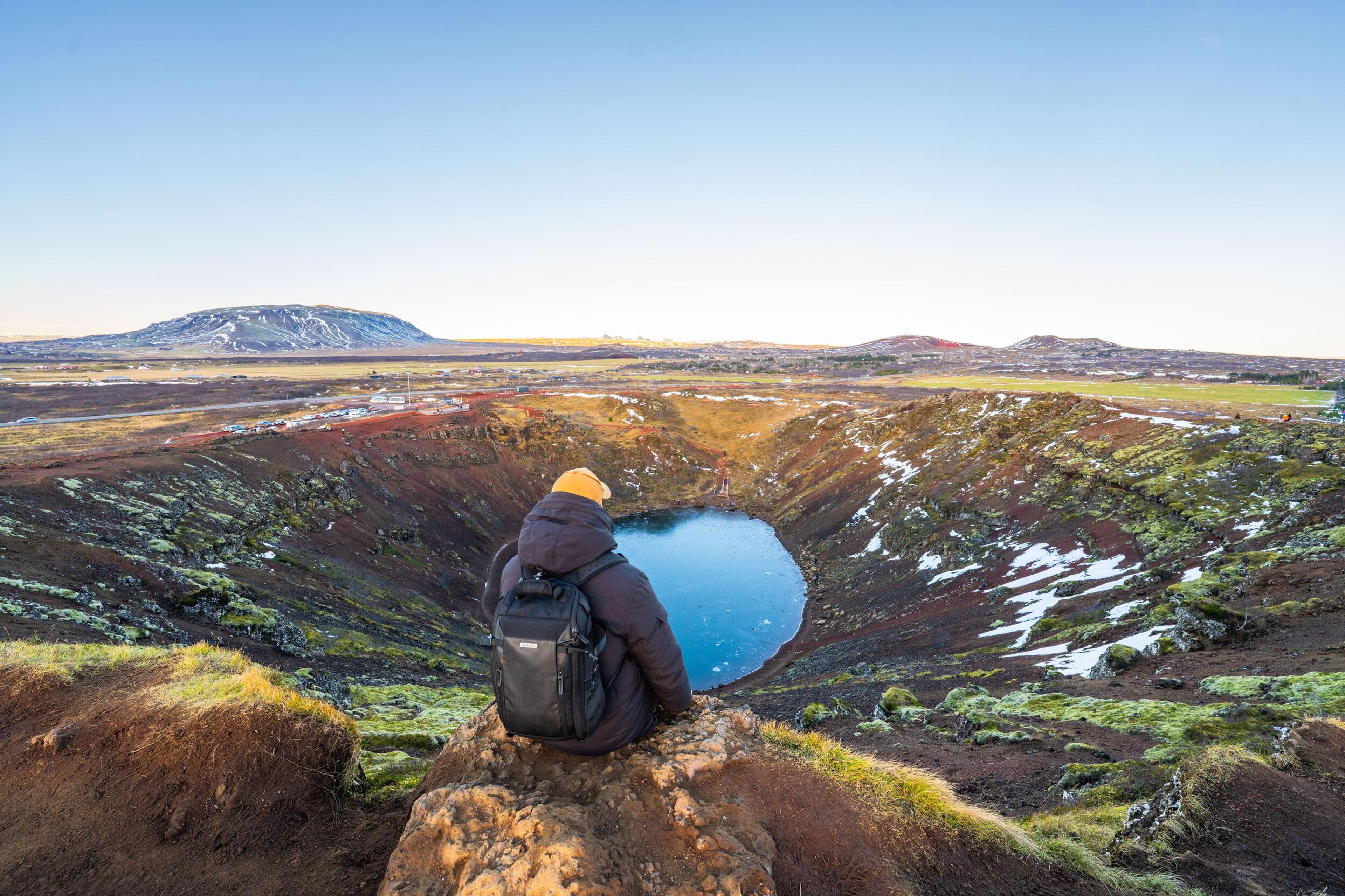 Kerið volcanic crater on Iceland's Golden Circle, its red slopes rising above a turquoise crater lake
