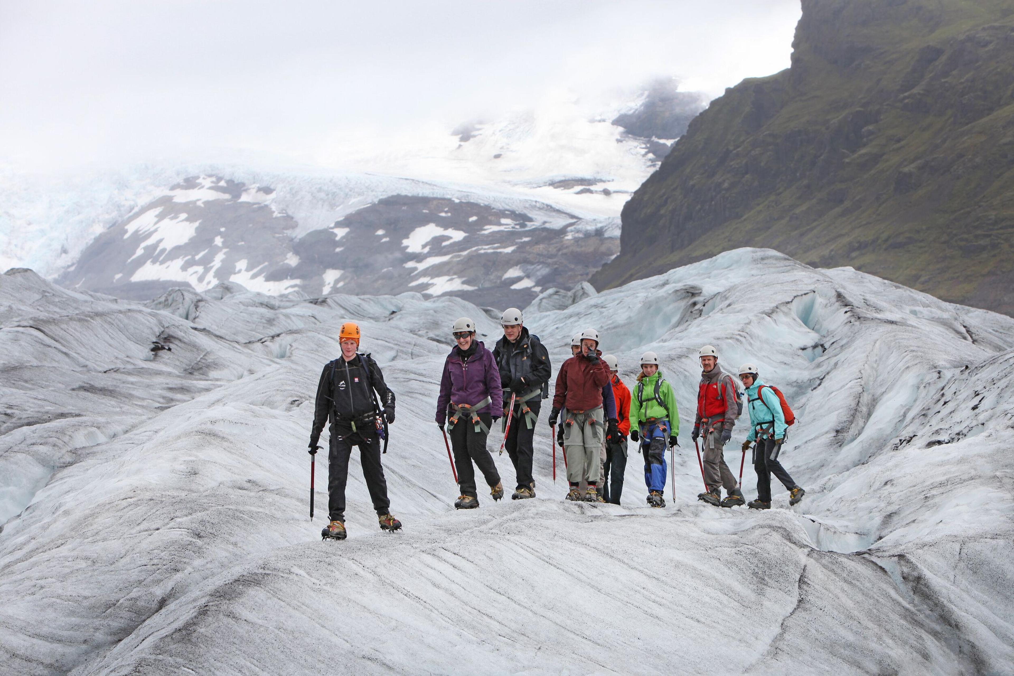 Group of people walking on a glacier in Iceland