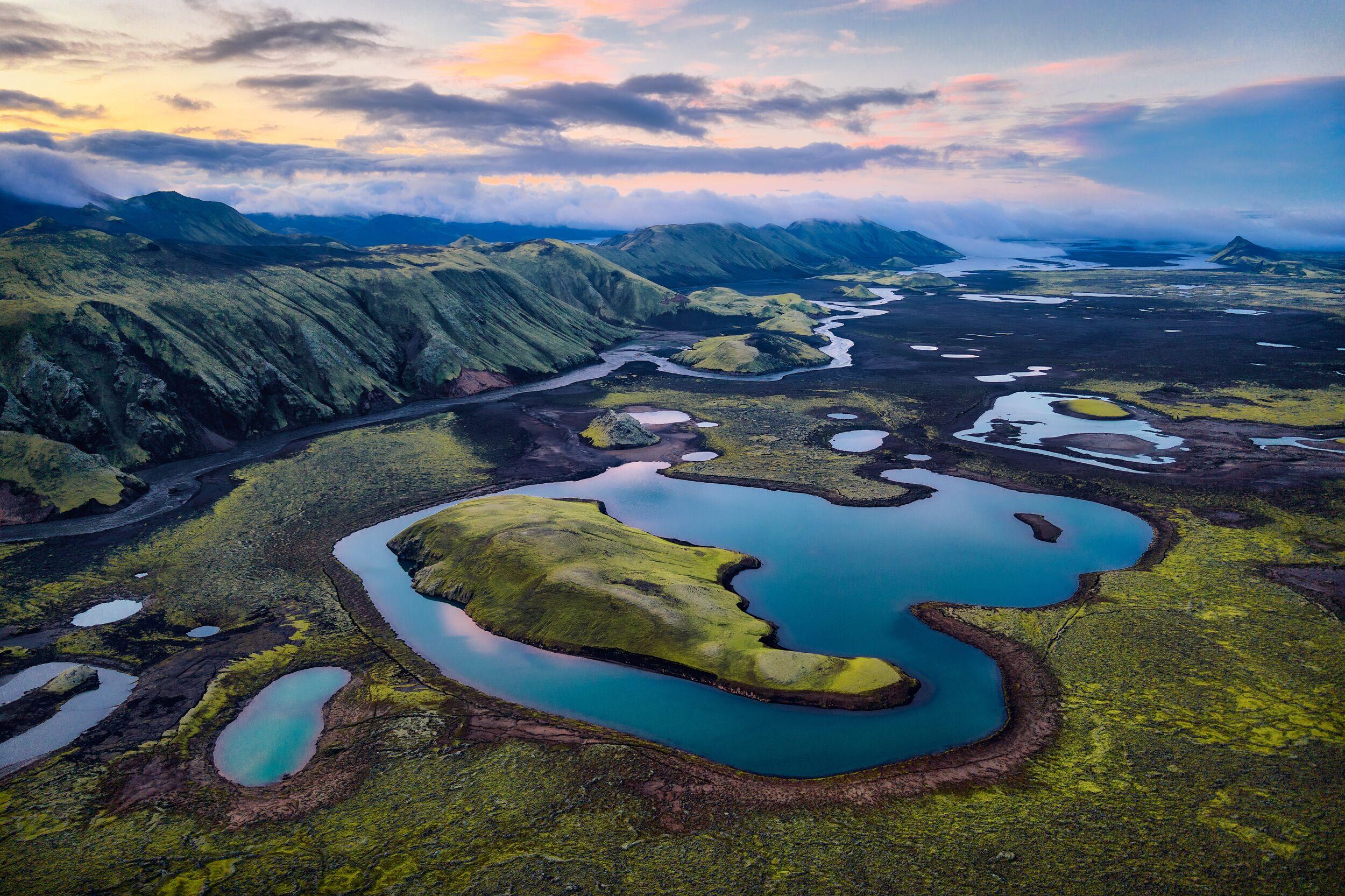 Aerial view of mossy islands and highland lakes at sunset – Iceland Highlands Super Jeep Tour.