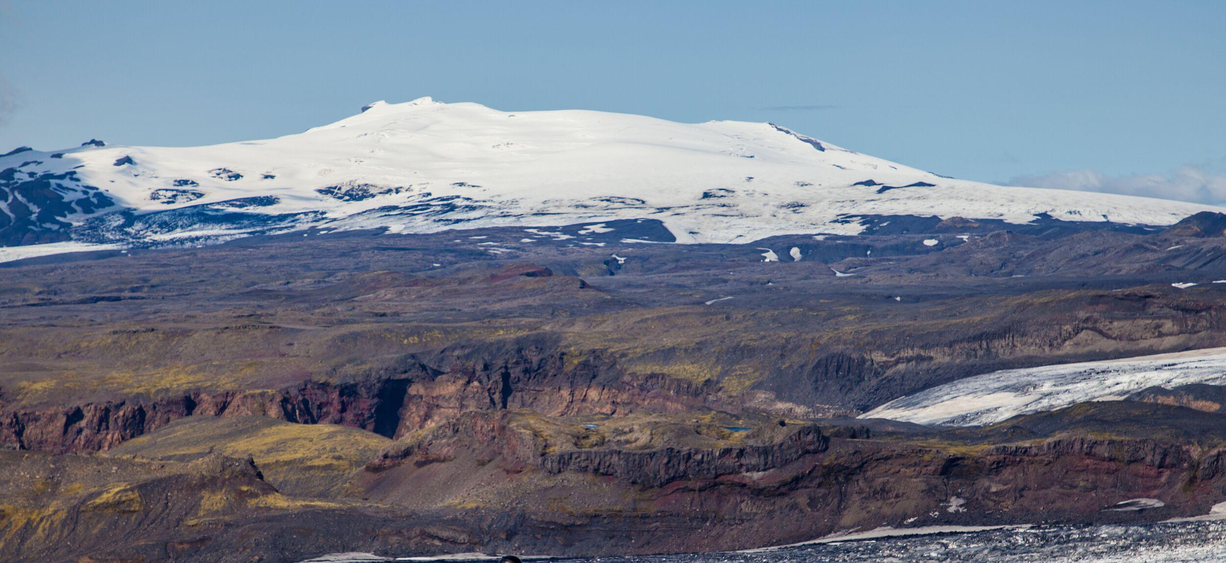 The view of the ice-capped Eyjafjallajökull volcano during a vibrant sunset
